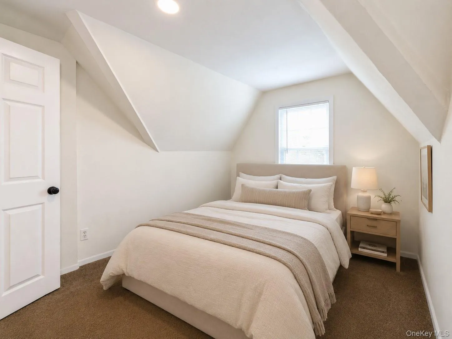 Virtual Staged Comfortable primary bedroom with soft carpeting, natural light, and charming architectural details that create a warm and inviting retreat. Virtual Staged Comfortable primary bedroom with soft carpeting, natural light, and charming architectural details that create a warm and inviting retreat.