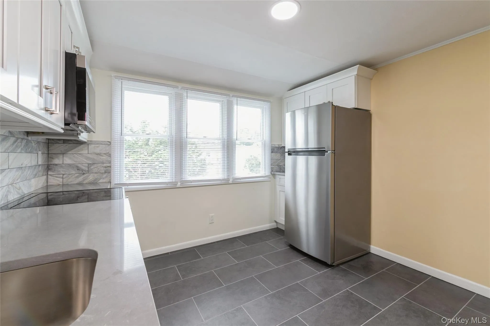 Open-concept kitchen and living area with modern finishes, perfect for everyday living and entertaining. Open-concept kitchen and living area with modern finishes, perfect for everyday living and entertaining.
