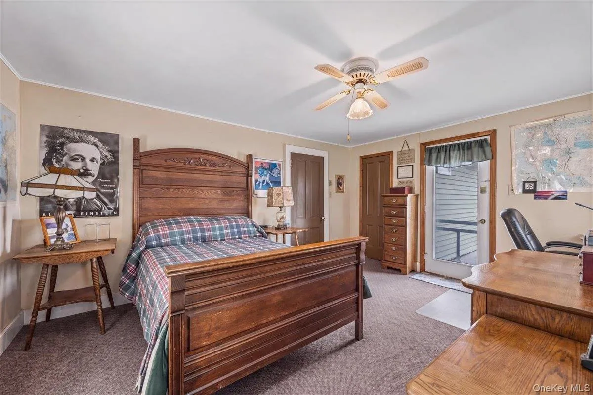 This bedroom also provides access to the second level deck with gorgeous yard and lake views. This bedroom also provides access to the second level deck with gorgeous yard and lake views.