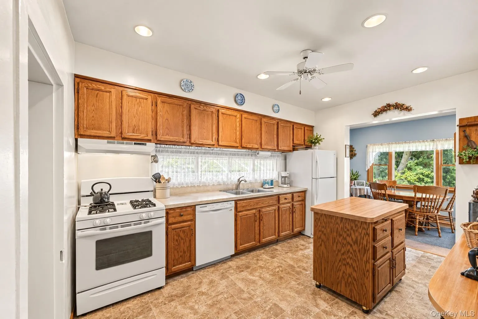 Kitchen provides ample counter and cabinet space along with an open concept toward the dining and living spaces. Kitchen provides ample counter and cabinet space along with an open concept toward the dining and living spaces.