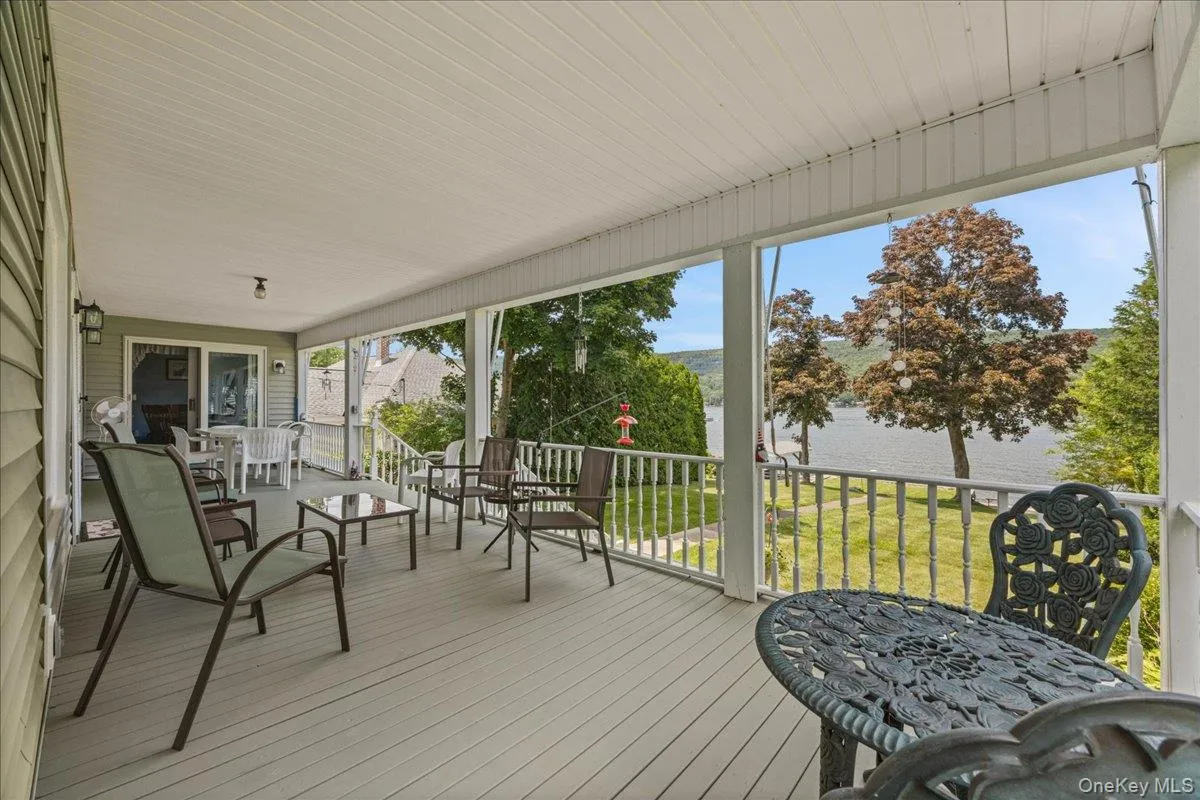 Gorgeous porch overlooking the yard and views of the lake. Gorgeous porch overlooking the yard and views of the lake.