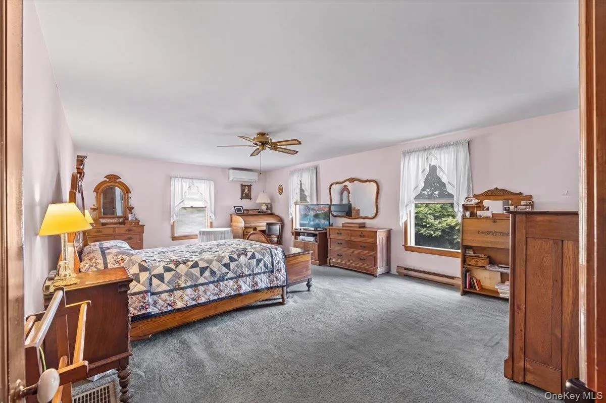 Large primary bedroom at the rear of the home includes a walk-in closet, en-suite bath and those great lake views. Large primary bedroom at the rear of the home includes a walk-in closet, en-suite bath and those great lake views.