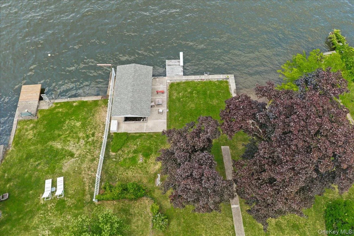 View looking towards the covered boat slip and lake. View looking towards the covered boat slip and lake.