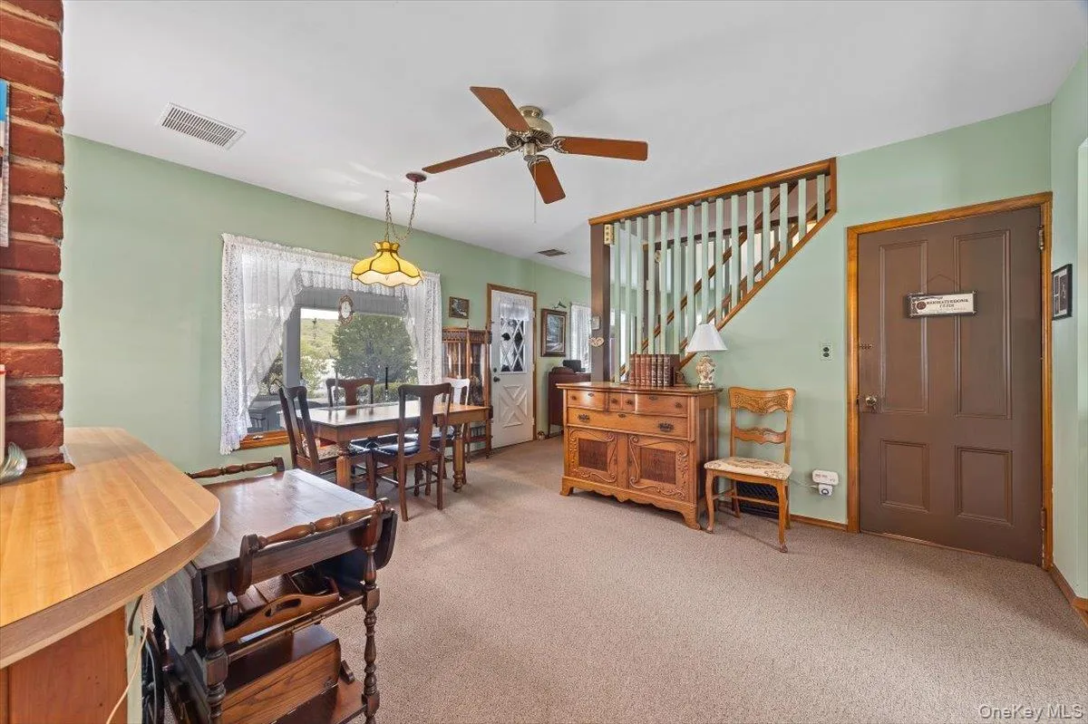 This room provides an option for a dining area as well as additional living room. This room provides an option for a dining area as well as additional living room.