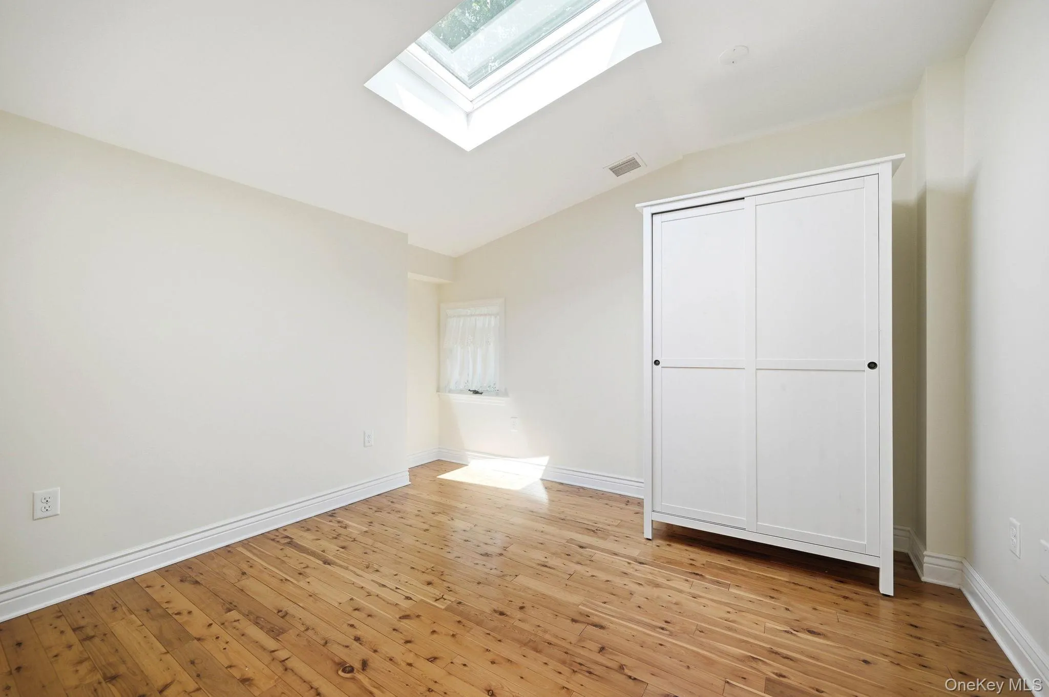 Second Floor Bedroom with Skylight. Second Floor Bedroom with Skylight.