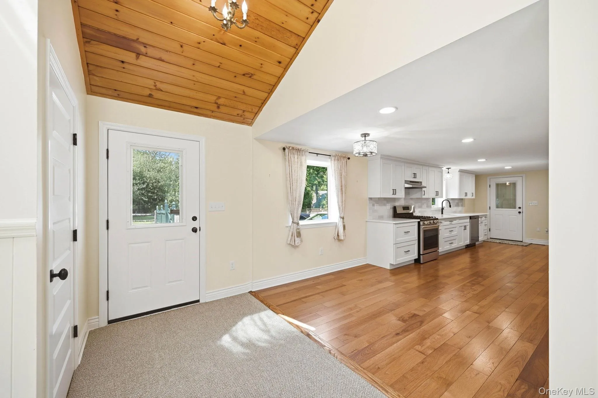 Door to the fenced in backyard and patio. Full Pantry Closet through the door to the left. Door to the fenced in backyard and patio. Full Pantry Closet through the door to the left.