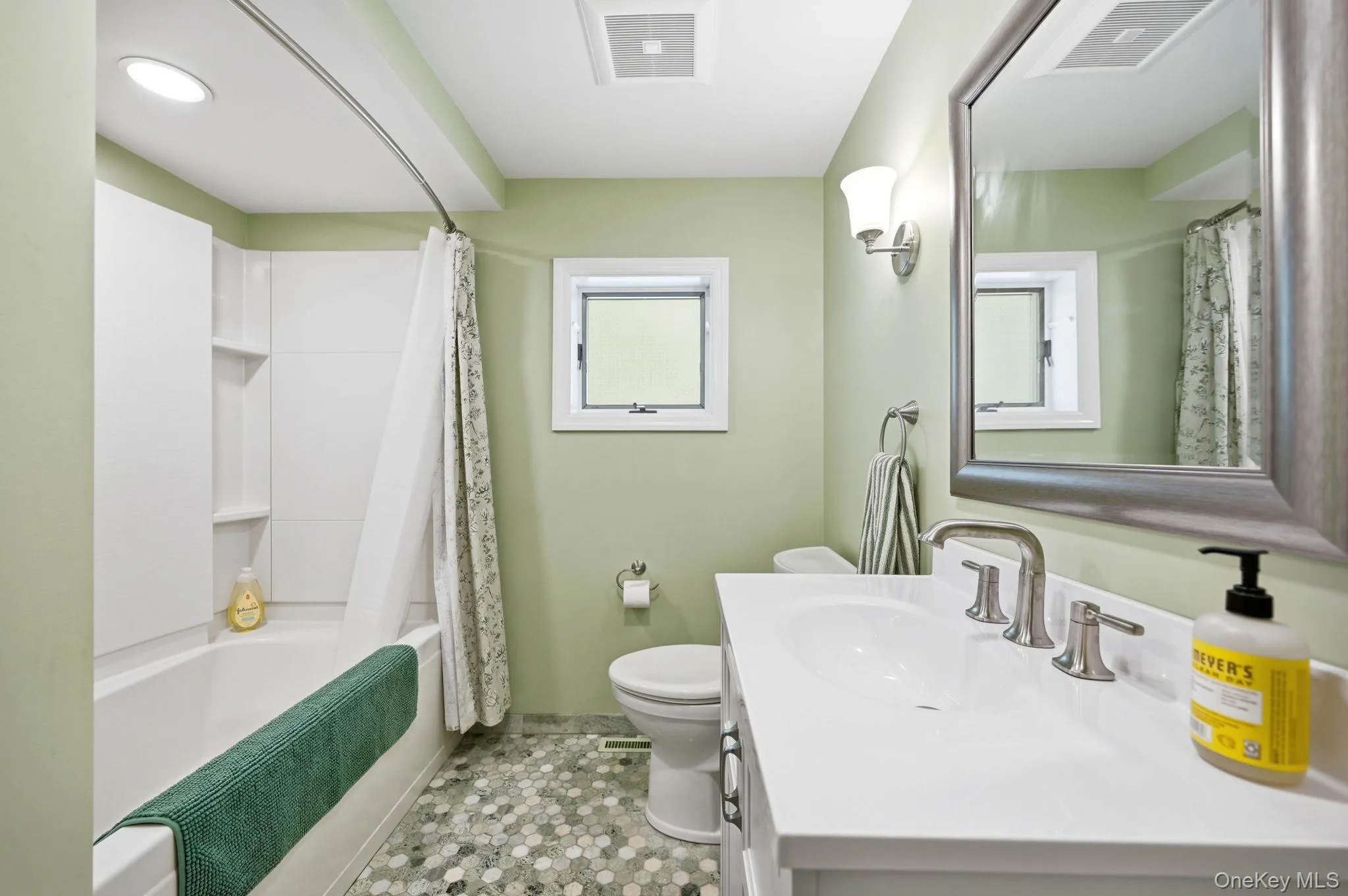 First Floor Bathroom. Every detail in this bathroom is gorgeous-From the Tilework to the Vanity and the Mirror. All tastefully put together. First Floor Bathroom. Every detail in this bathroom is gorgeous-From the Tilework to the Vanity and the Mirror. All tastefully put together.
