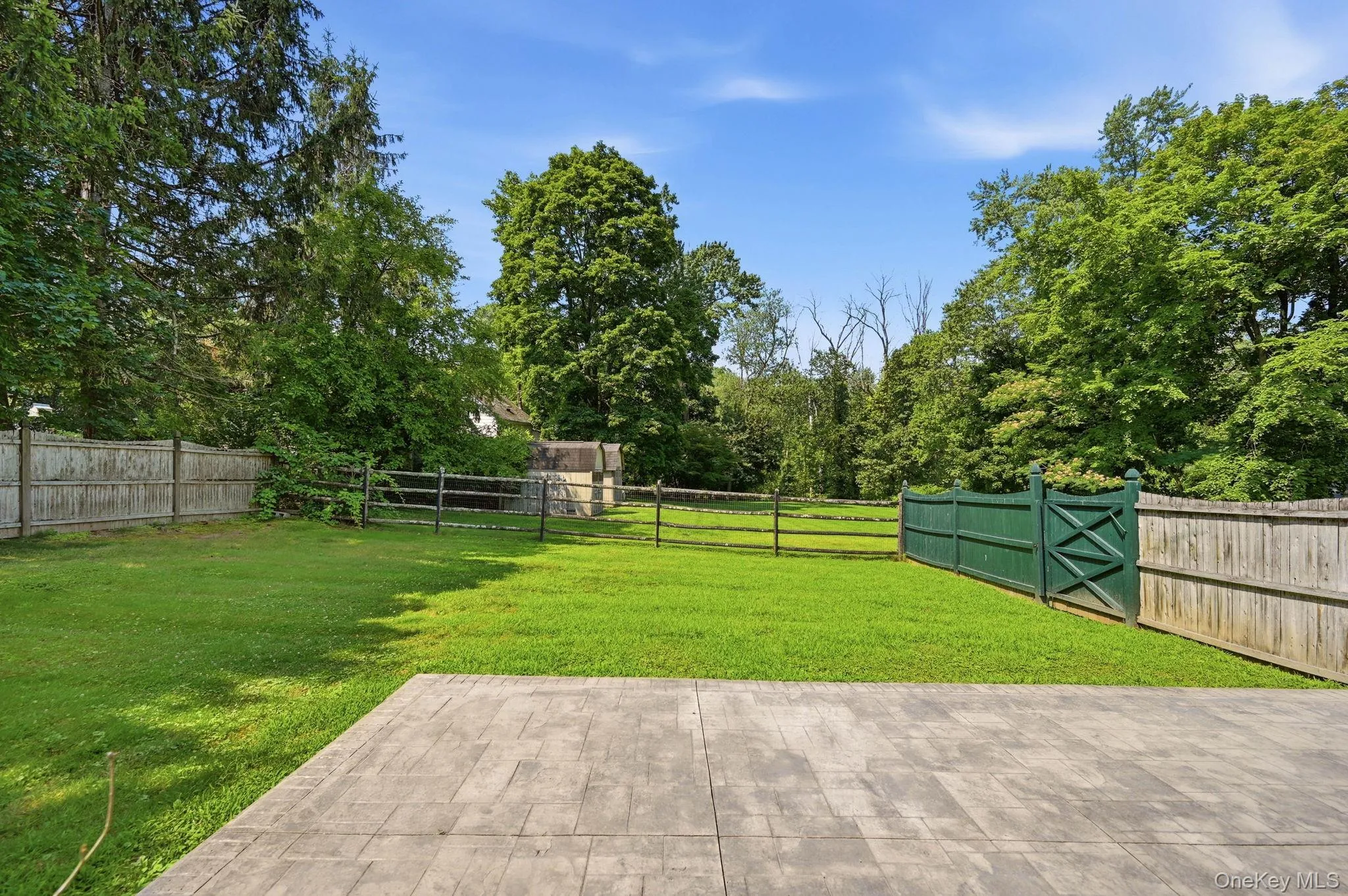 Fenced in Area of Yard With a Patio. Fenced in Area of Yard With a Patio.