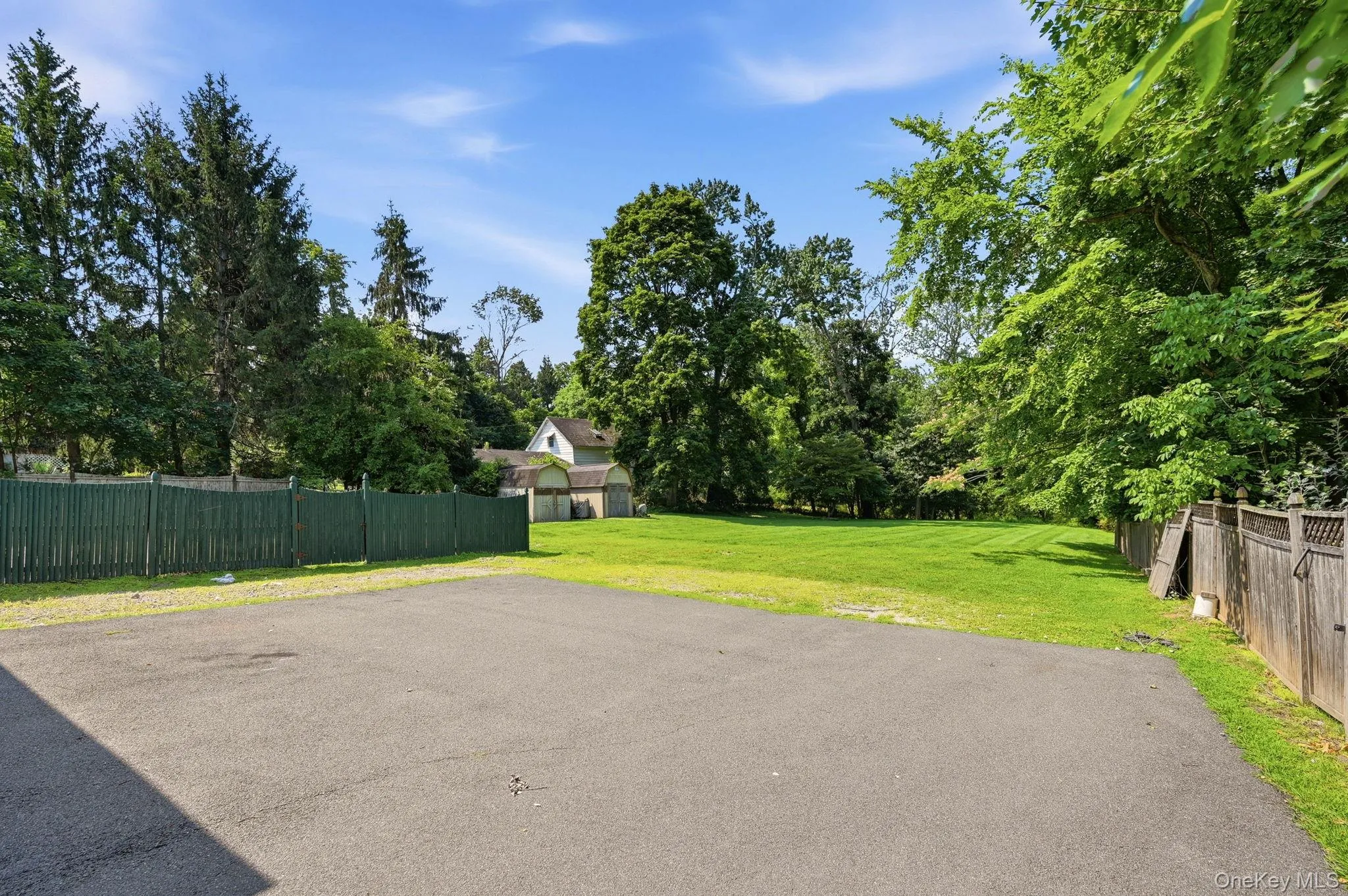 Parking area at the end of the driveway behind the home. Parking area at the end of the driveway behind the home.