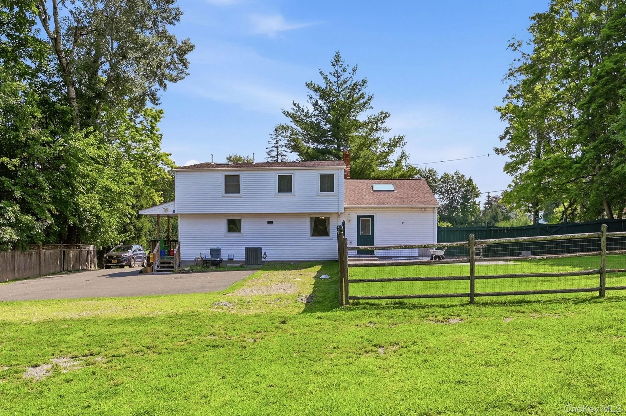 Large Parking Area in the Back of Home and fenced in portion of the yard with a patio. Large Parking Area in the Back of Home and fenced in portion of the yard with a patio.