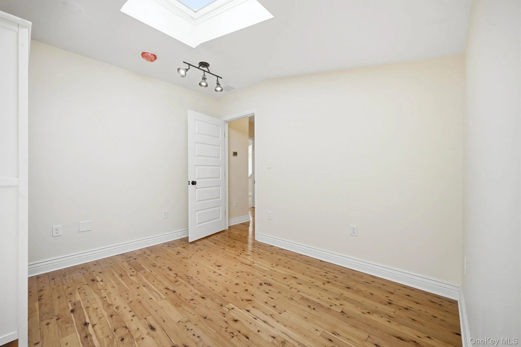 Second Floor Bedroom with Skylight. Second Floor Bedroom with Skylight.