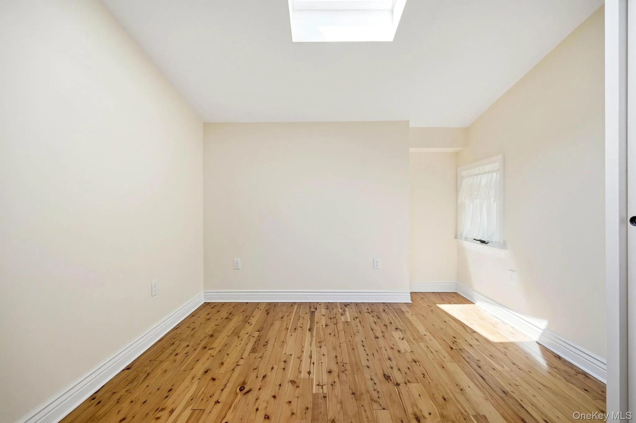 Second Floor Bedroom with Skylight. Second Floor Bedroom with Skylight.