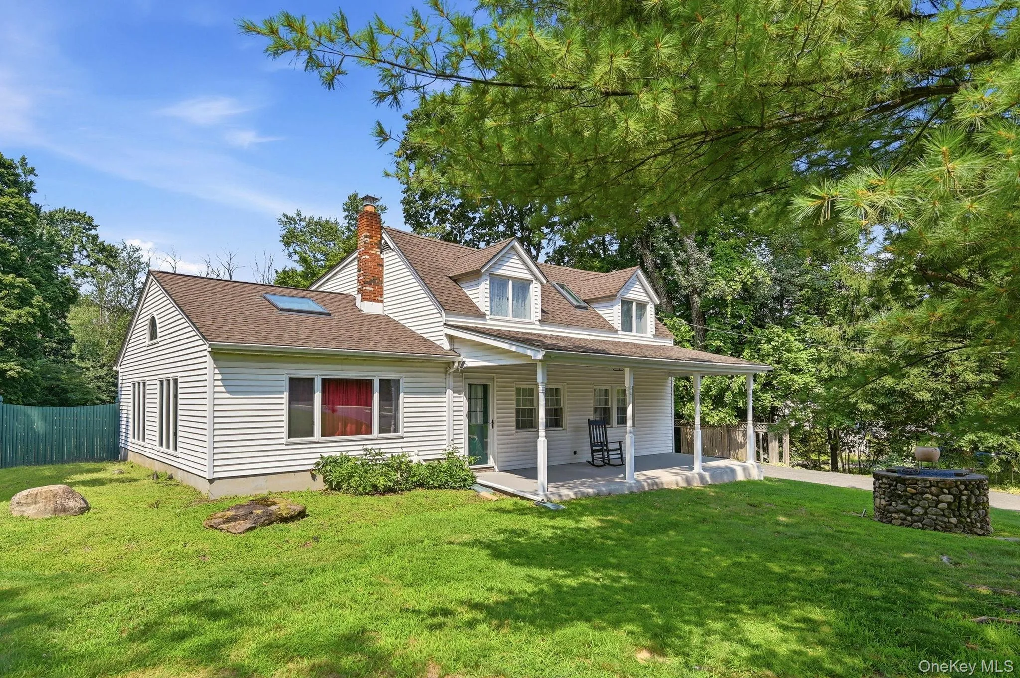 Front of home with a Rocking Chair Front Porch. Front of home with a Rocking Chair Front Porch.