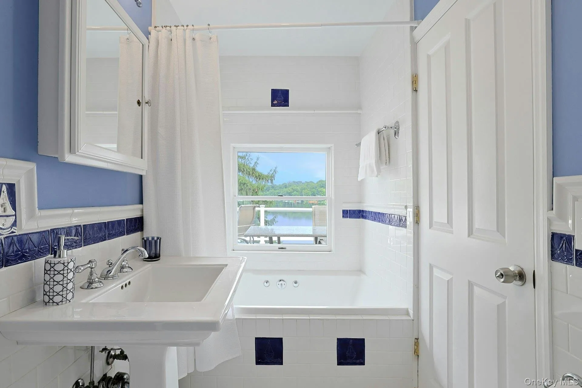 The adjoining bath also has an entrance from the hall and serves the third bedroom across the hall, with serene lake views, bringing beauty and a sense of calm to your daily routine. The adjoining bath also has an entrance from the hall and serves the third bedroom across the hall, with serene lake views, bringing beauty and a sense of calm to your daily routine.