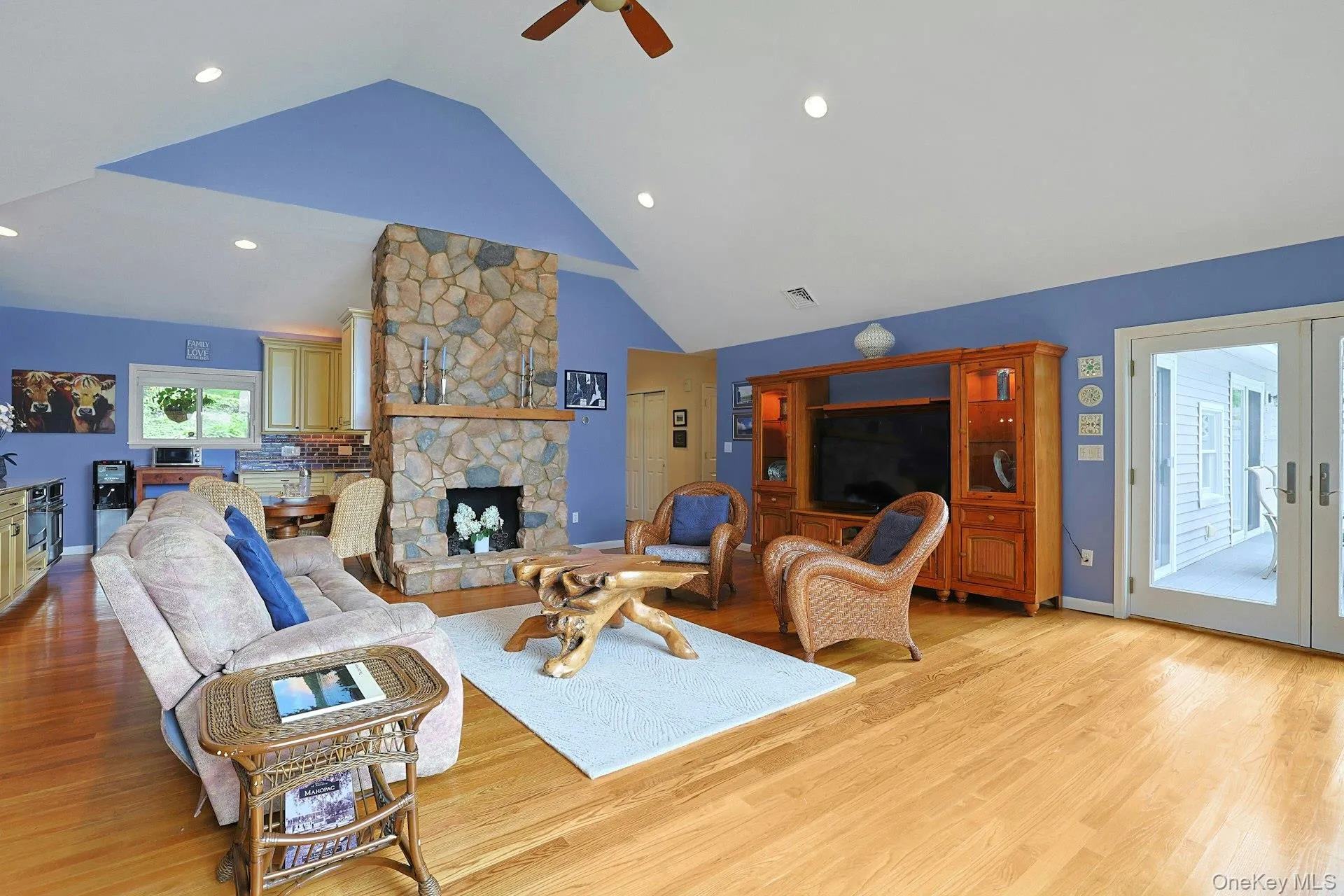 The heart of this home features a stunning stone fireplace. The living room opens to the kitchen, dining room and the deck, all with beautiful lake views. The heart of this home features a stunning stone fireplace. The living room opens to the kitchen, dining room and the deck, all with beautiful lake views.