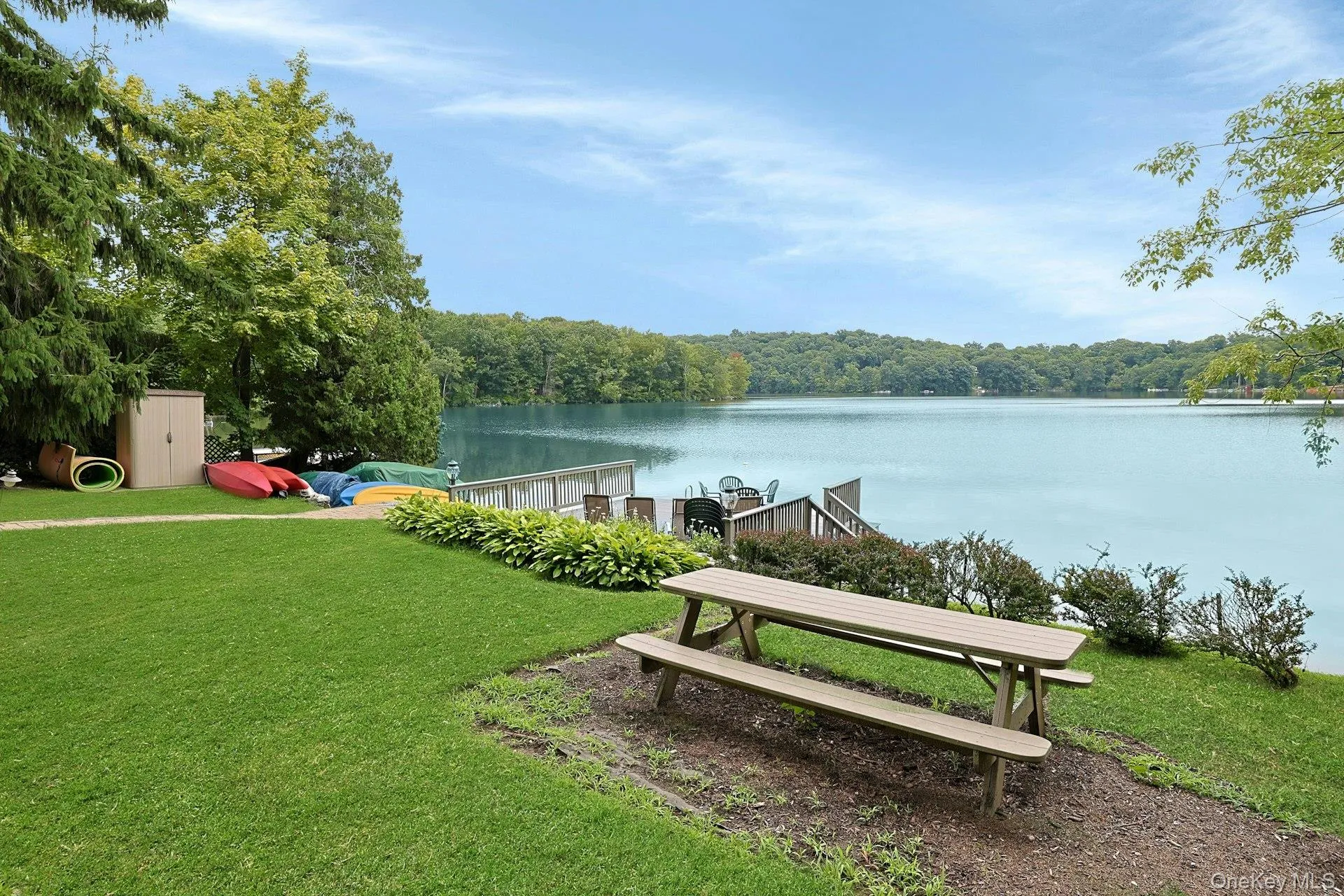 Enjoy outdoor dining by the water's edge, where peaceful lake views create the perfect backdrop. The few neighboring homes are set back, with no one to block any part of your view. Enjoy outdoor dining by the water's edge, where peaceful lake views create the perfect backdrop. The few neighboring homes are set back, with no one to block any part of your view.