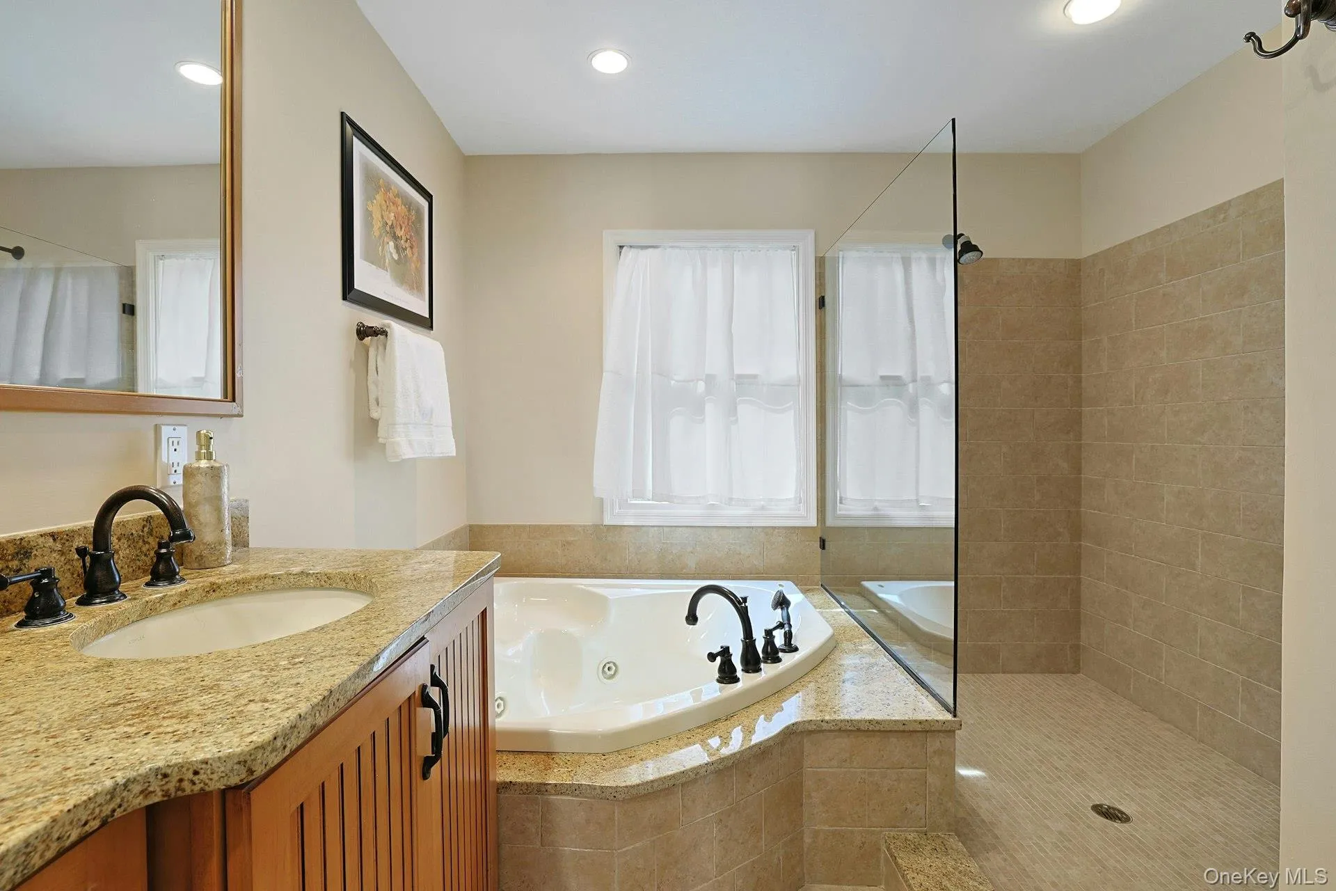 The expansive primary bathroom also has an oversized walk-in shower The expansive primary bathroom also has an oversized walk-in shower