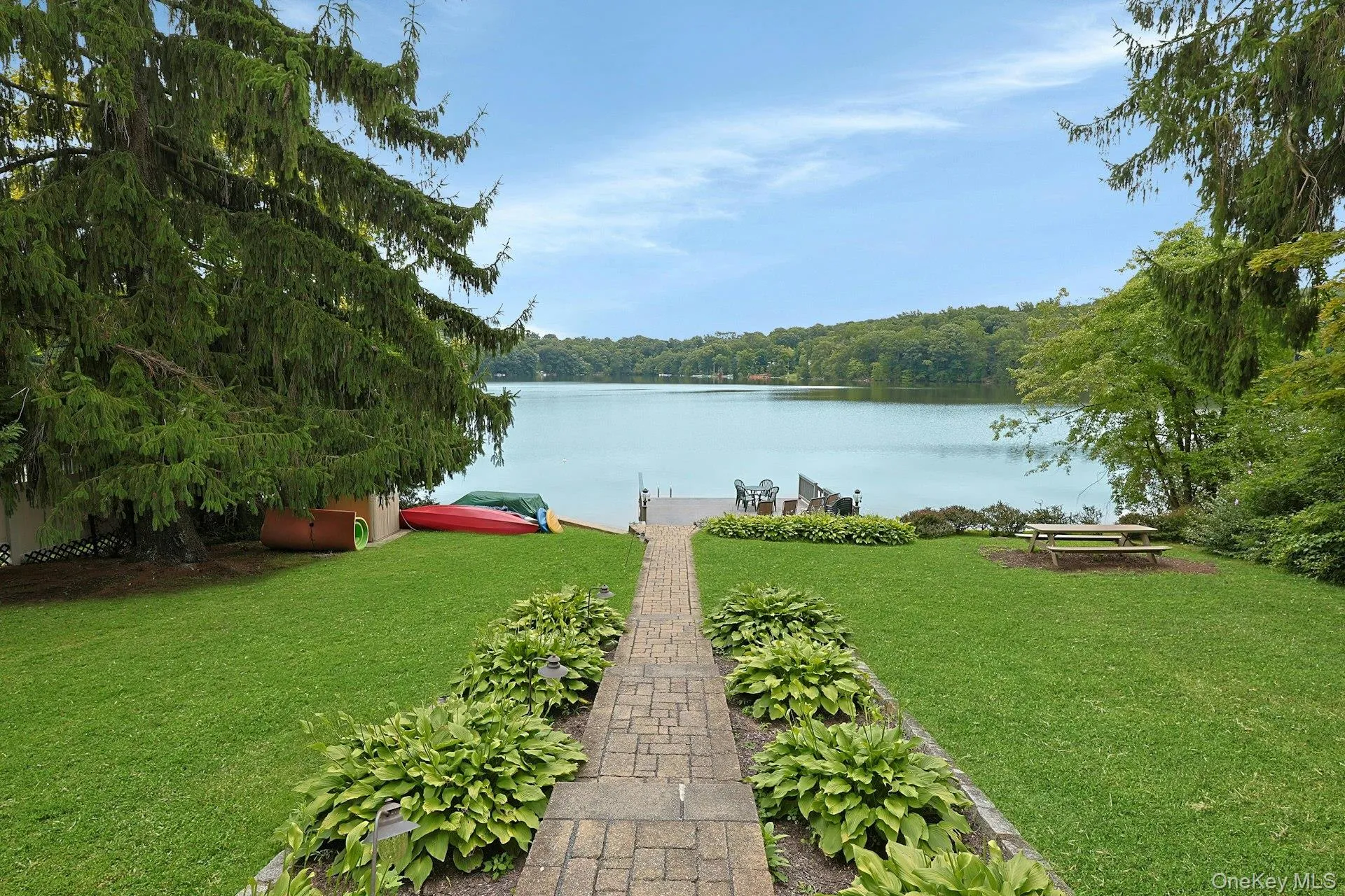 A Unilock paver walkway leads you directly to the lake, where days of waterfront enjoyment await. Laps first thing in the morning or to wash away the stress of the day? A Unilock paver walkway leads you directly to the lake, where days of waterfront enjoyment await. Laps first thing in the morning or to wash away the stress of the day?