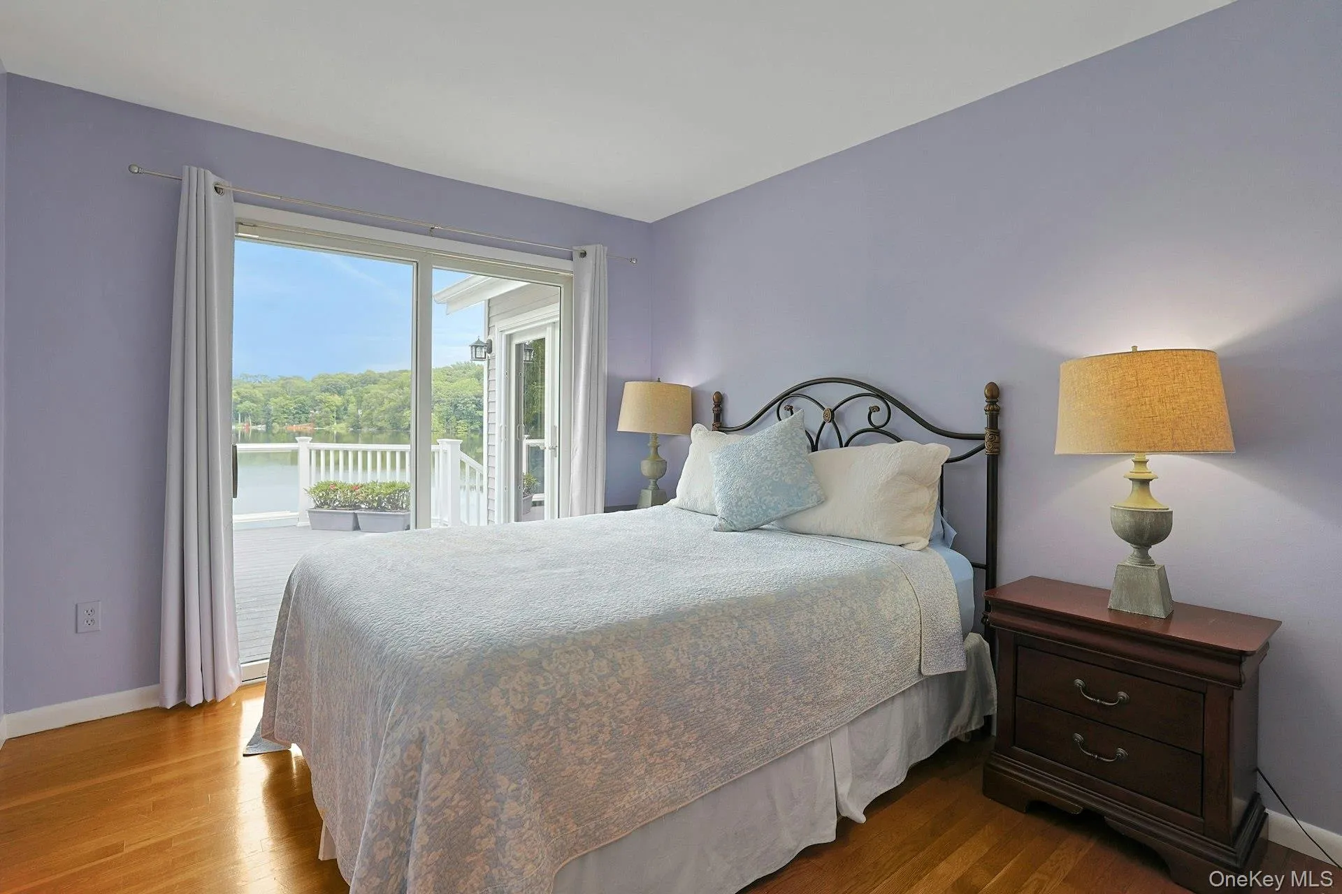 The second bedroom opens directly onto the deck, where beautiful lake views create a peaceful retreat just steps from your room. The second bedroom opens directly onto the deck, where beautiful lake views create a peaceful retreat just steps from your room.