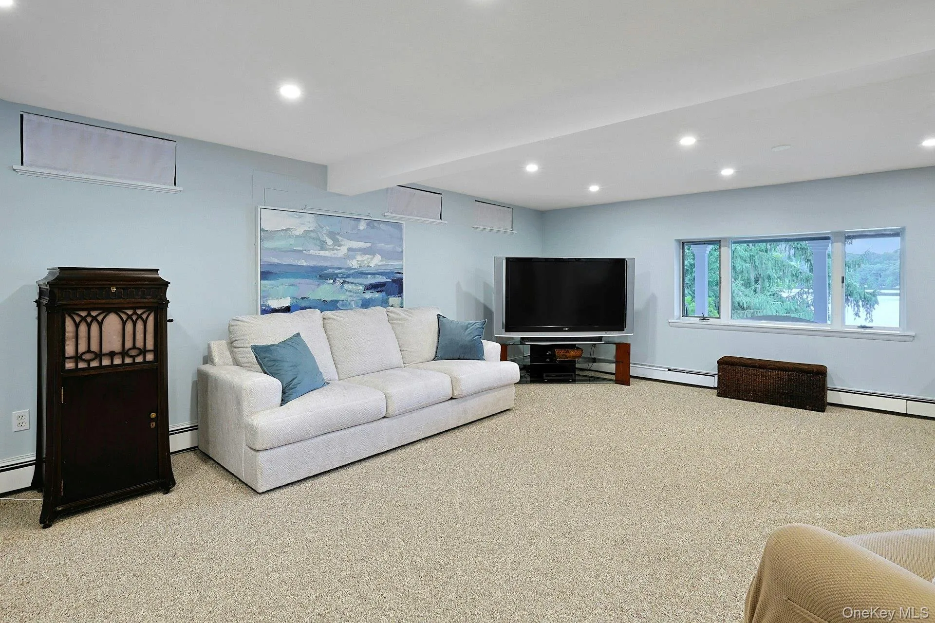 On the lower level, the spacious family room also offers beautiful lake views, creating the perfect place to relax, gather, and enjoy the scenery. On the lower level, the spacious family room also offers beautiful lake views, creating the perfect place to relax, gather, and enjoy the scenery.