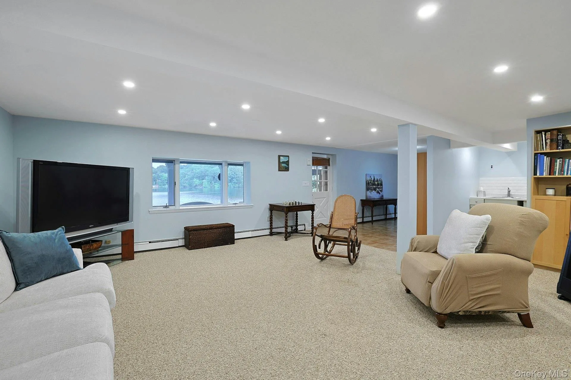 The family room leads directly to the patio, backyard and the lake. The family room leads directly to the patio, backyard and the lake.