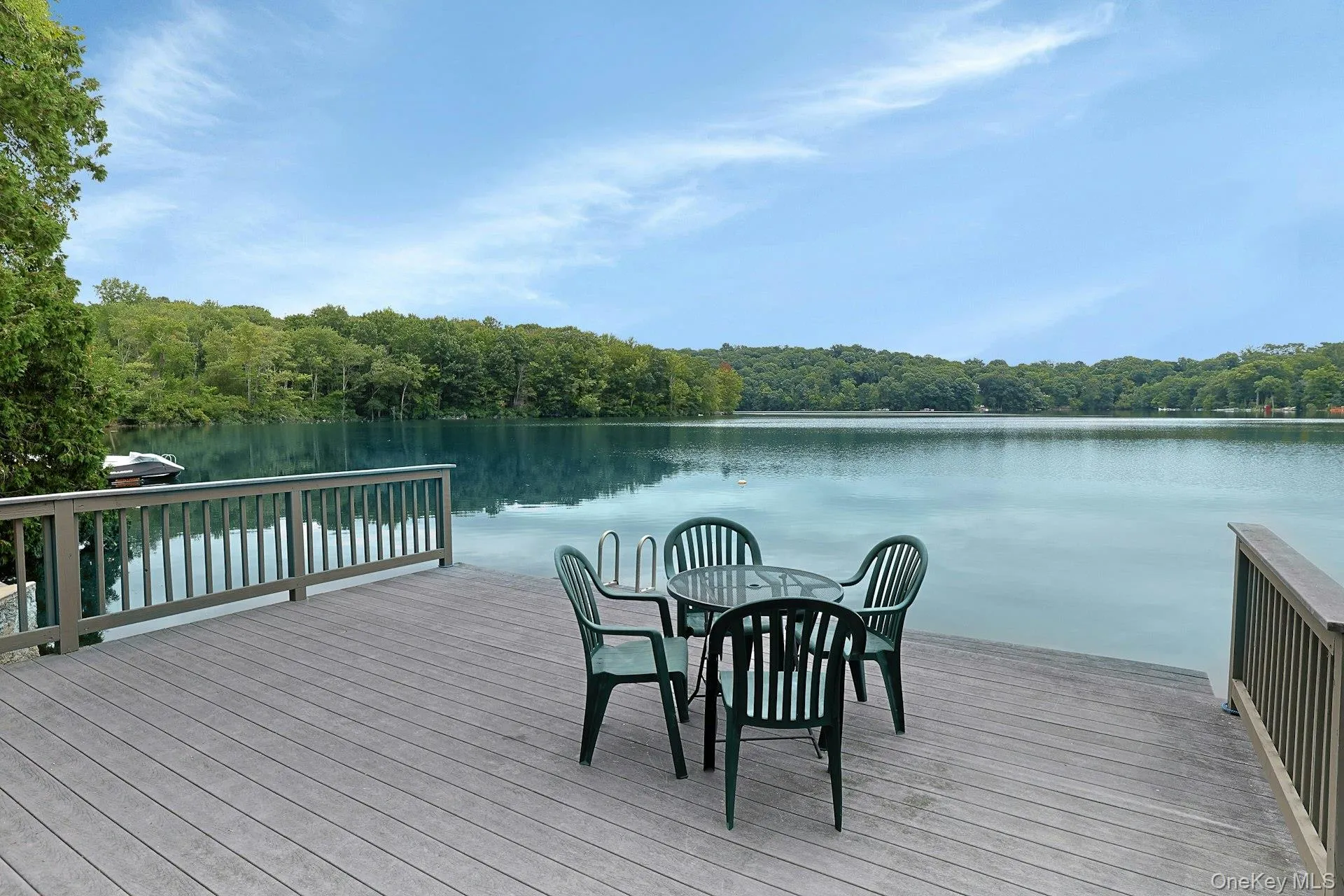 Additional private Trex waterfront deck and dock are the perfect launch point for boating, kayaking, fishing, swimming, and simply enjoying life on the lake. Dive in! Additional private Trex waterfront deck and dock are the perfect launch point for boating, kayaking, fishing, swimming, and simply enjoying life on the lake. Dive in!