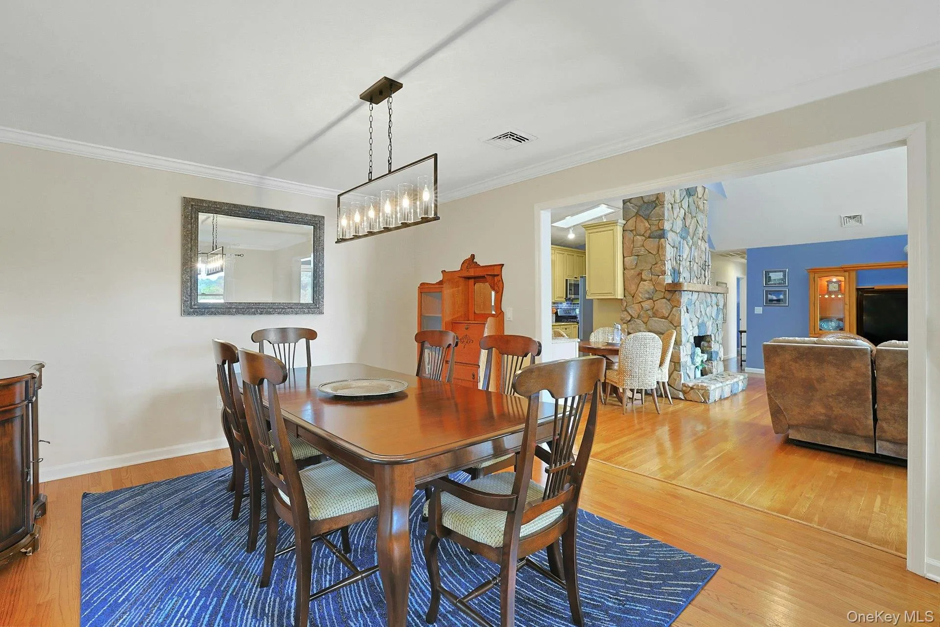 The dining room flows seamlessly into both the living room and kitchen, creating an open, inviting space The dining room flows seamlessly into both the living room and kitchen, creating an open, inviting space