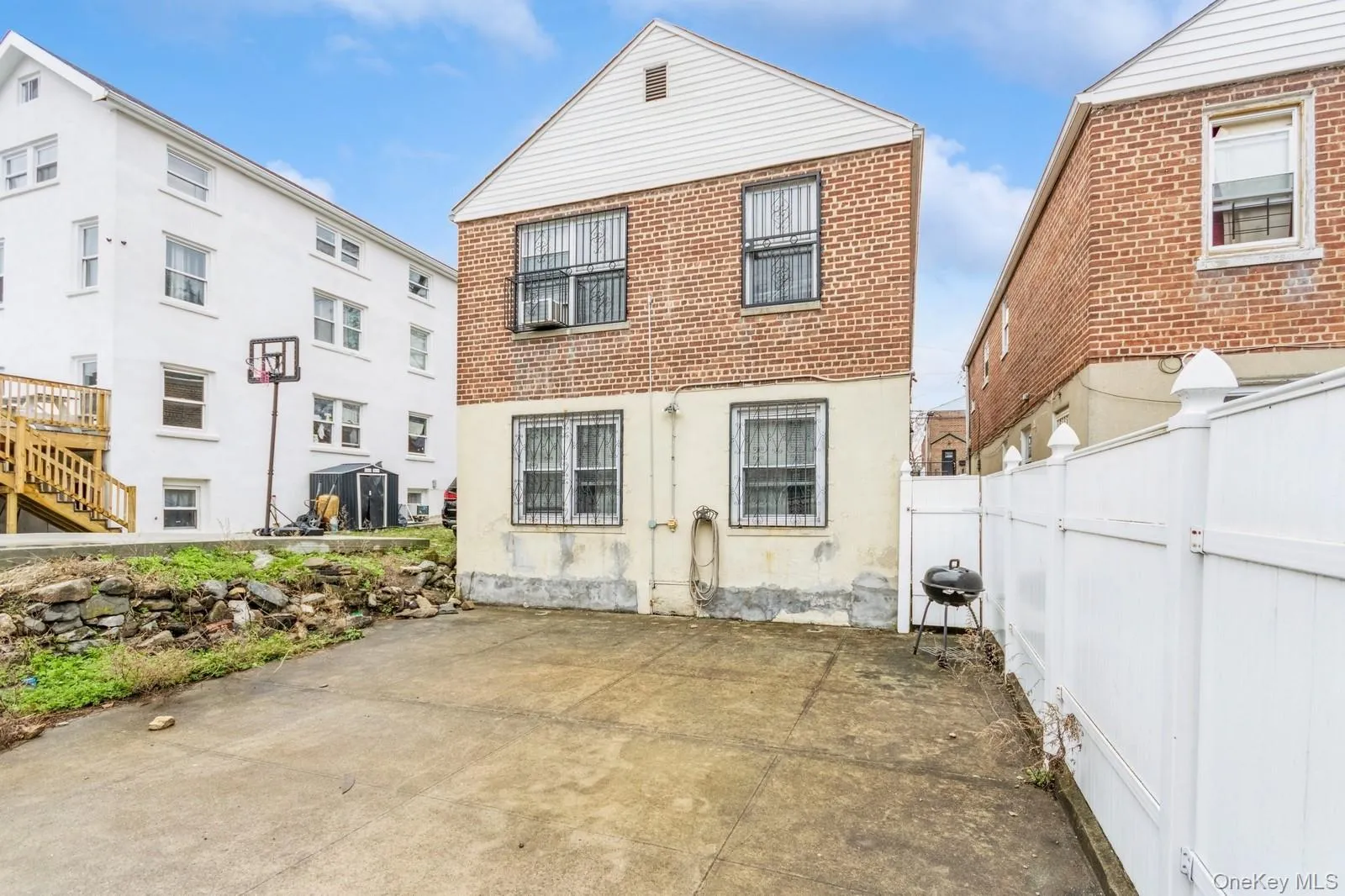 Back of property featuring a patio area and fence Back of property featuring a patio area and fence