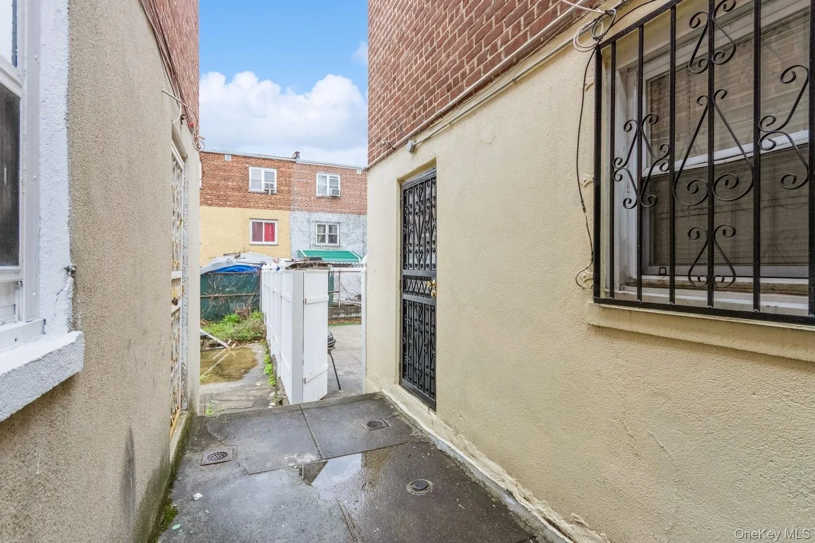 View of exterior entry to basement apartment. View of exterior entry to basement apartment.