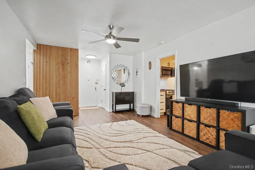 Living Room has a ceiling fan with light Living Room has a ceiling fan with light