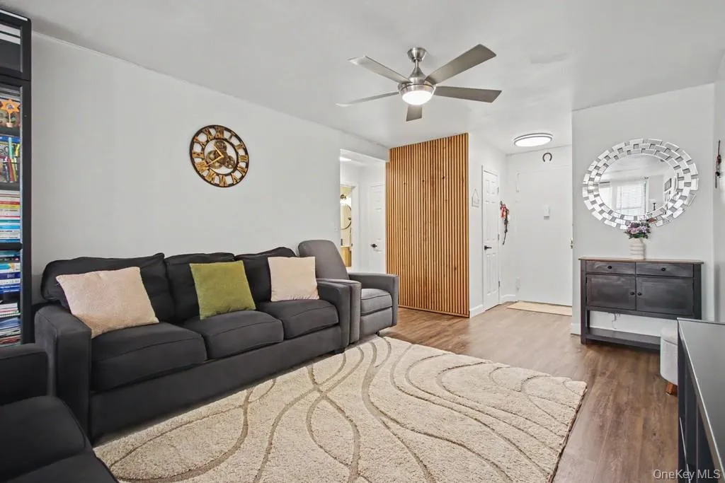 Living Room has a ceiling fan with light Living Room has a ceiling fan with light