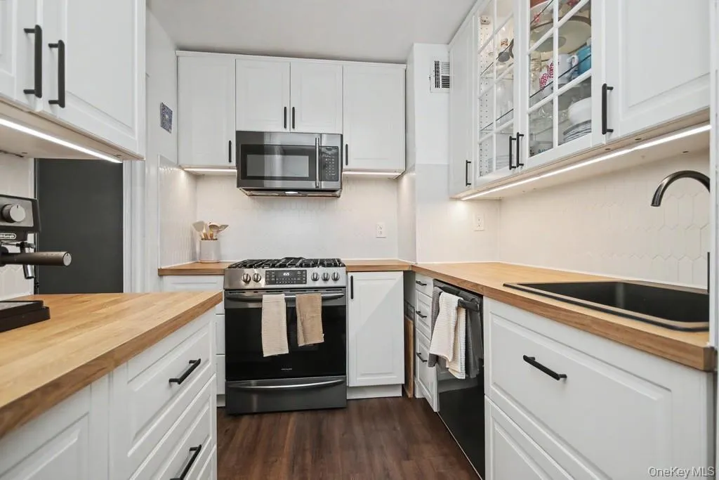 Updated kitchen featuring butcher block counters Updated kitchen featuring butcher block counters