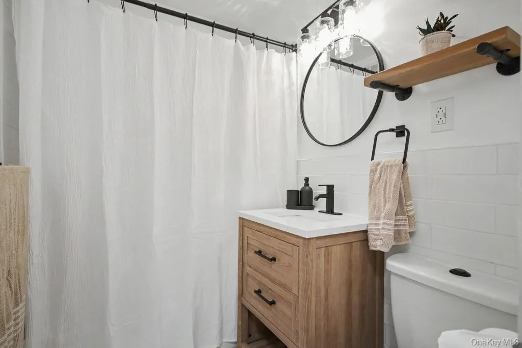 Updated bathroom has as sink with vanity Updated bathroom has as sink with vanity