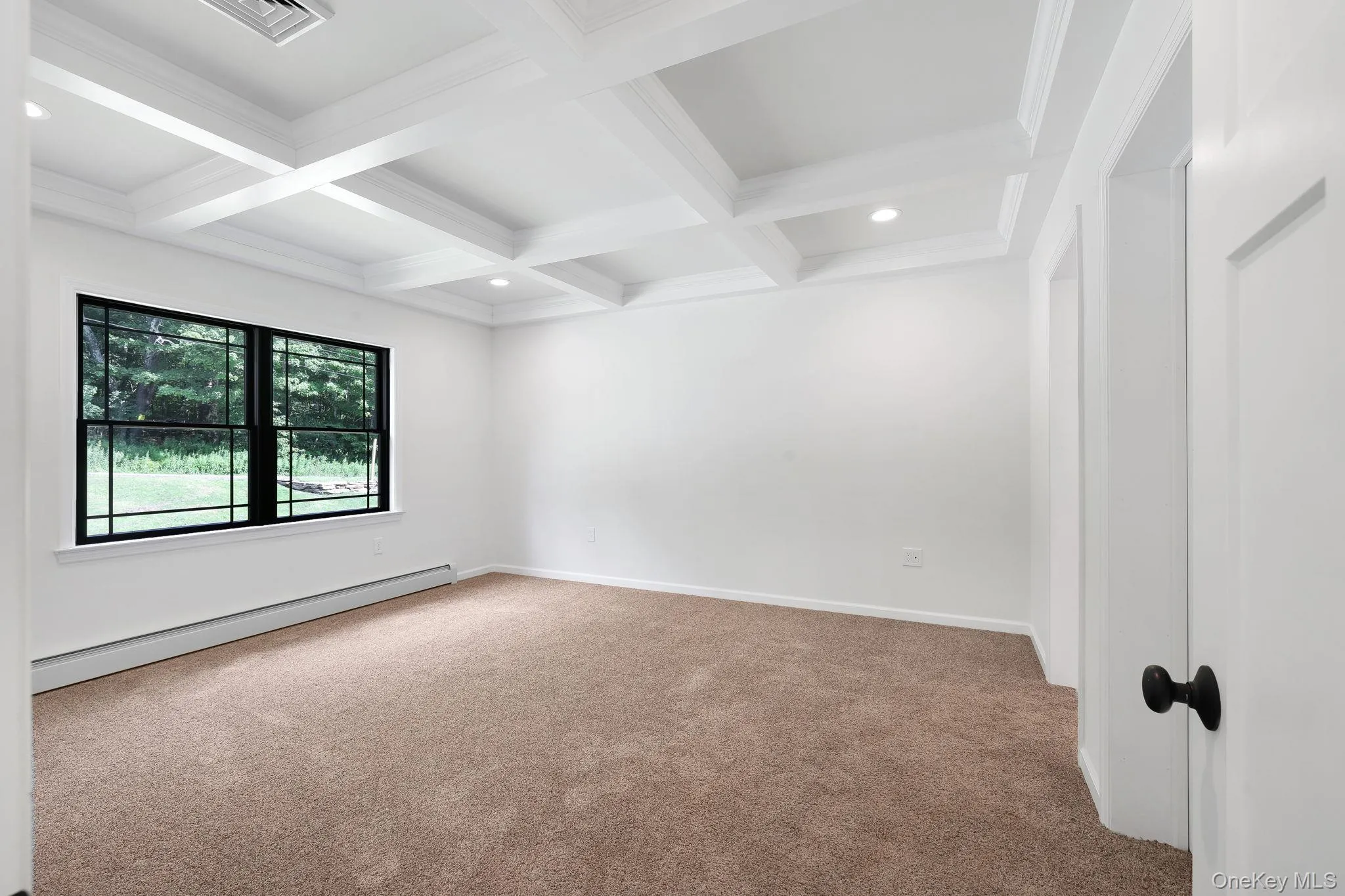Coffered ceilings in the primary Coffered ceilings in the primary