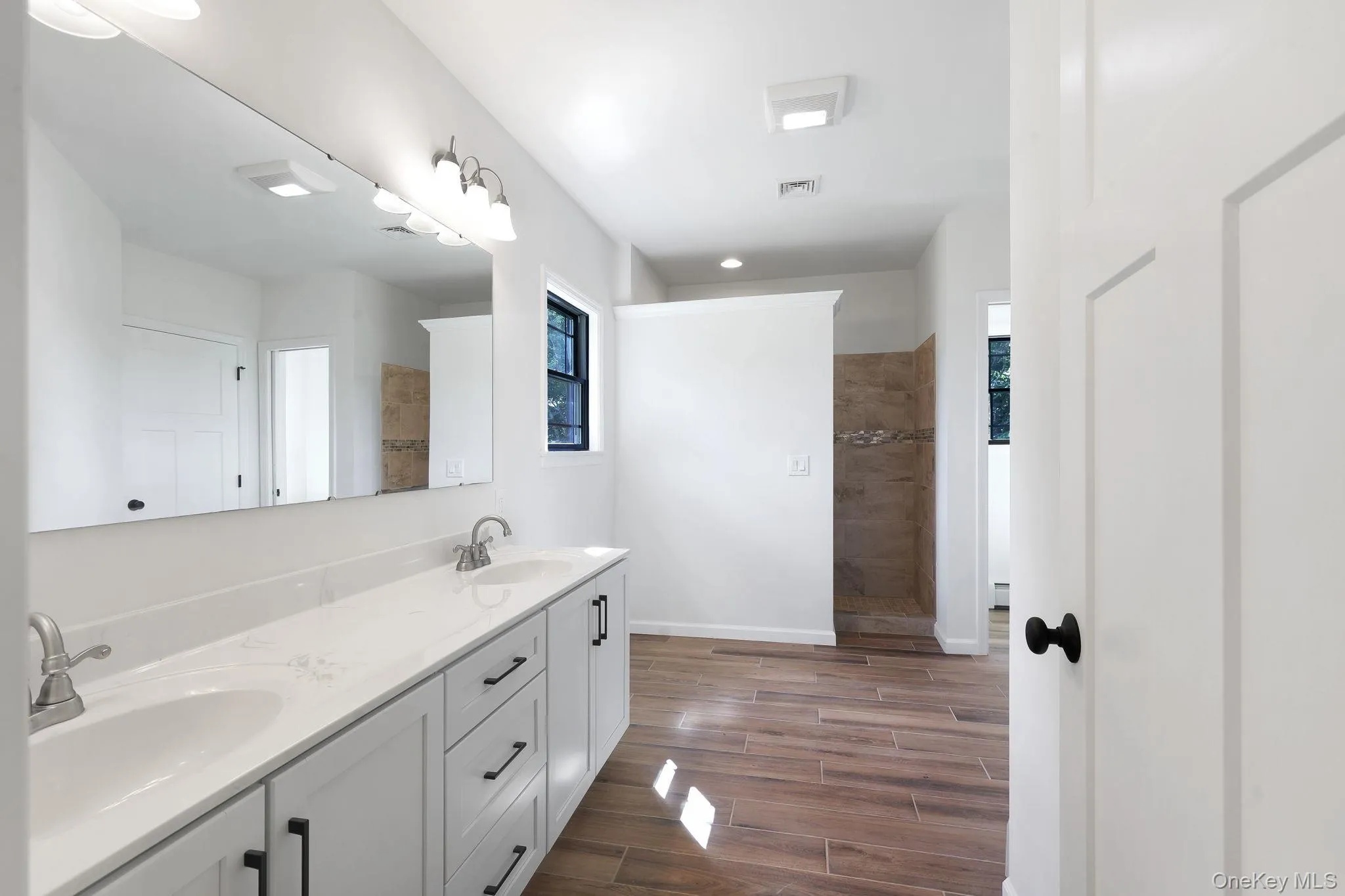 Walk-in shower and dual vanity in primary Walk-in shower and dual vanity in primary