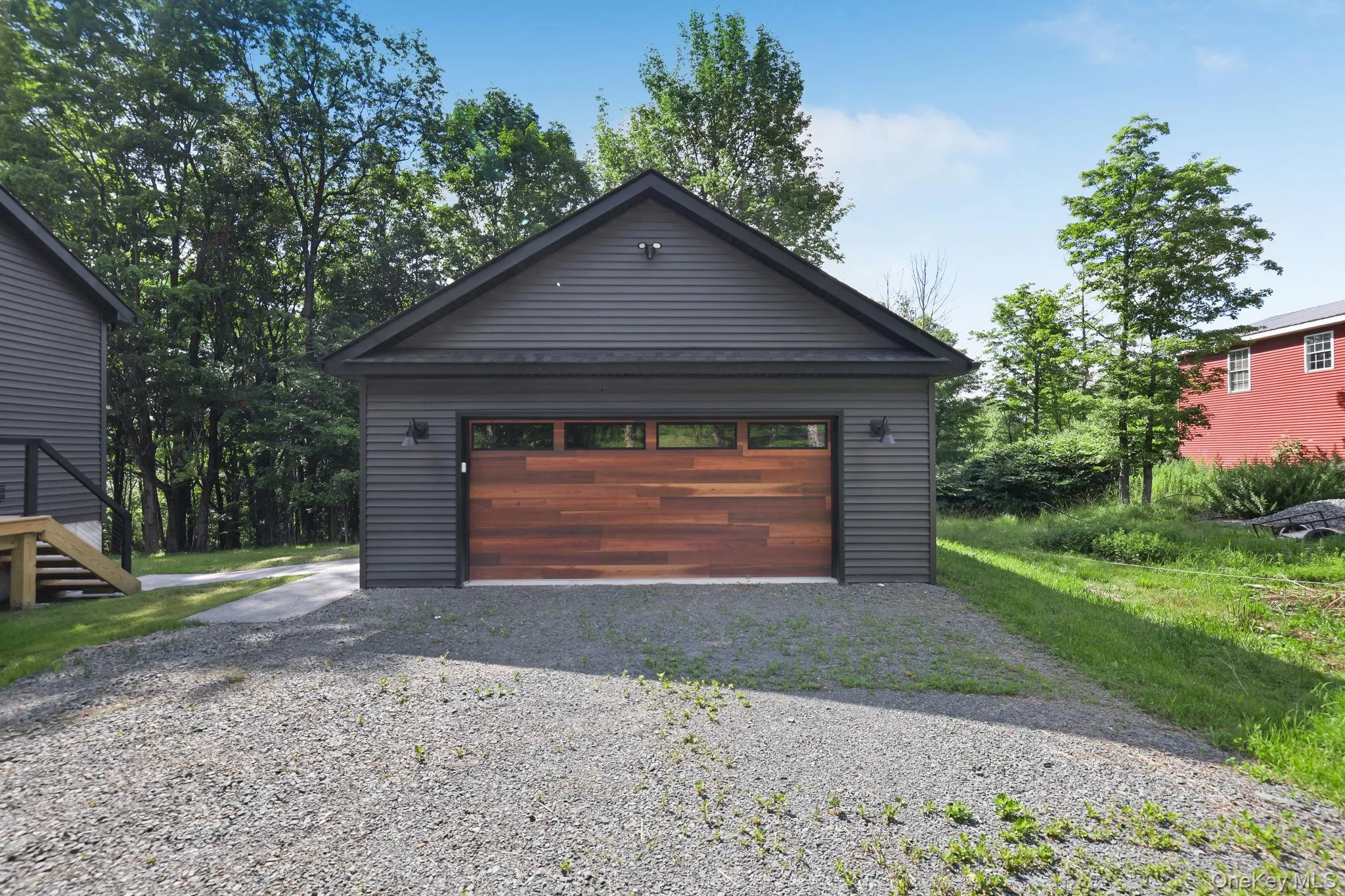 Two car garage from with walkway to the home. Two car garage from with walkway to the home.