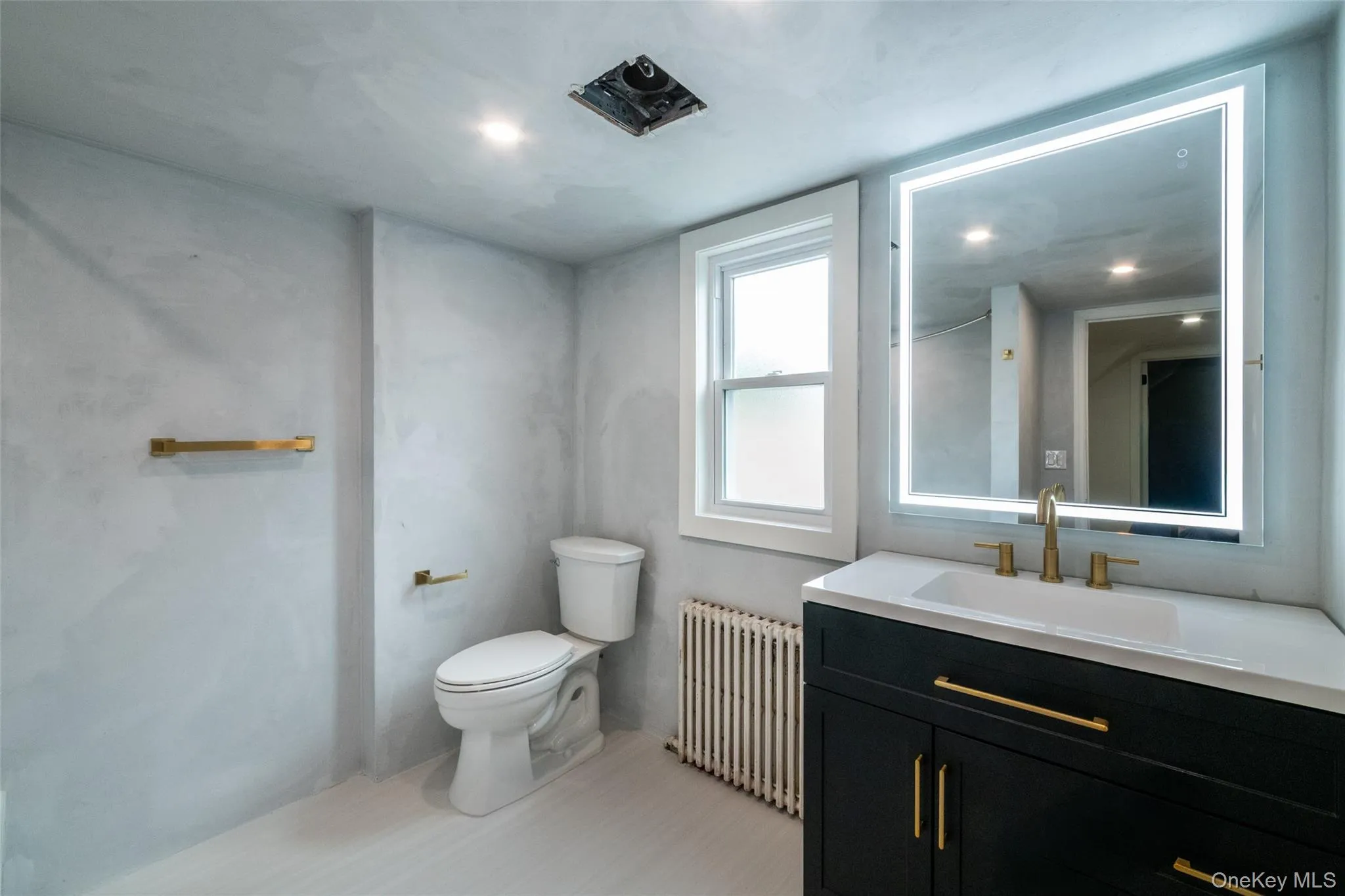 Another sleek and fully renovated bathroom with a tub is conveniently located on the second floor. Vent cover will be put in prior to closing date. Another sleek and fully renovated bathroom with a tub is conveniently located on the second floor. Vent cover will be put in prior to closing date.