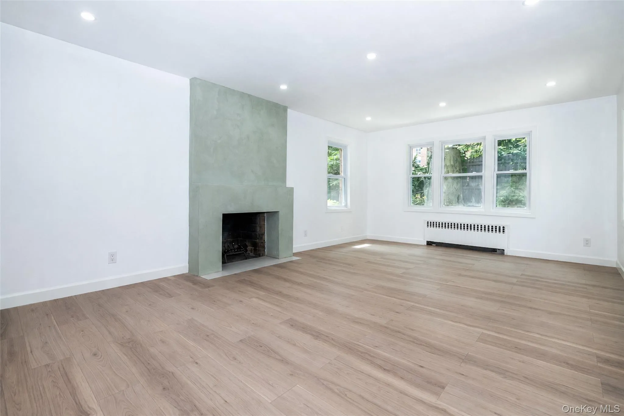 The formal living room has a fireplace that beckons a European villa, recessed lighting, and pocket doors. The formal living room has a fireplace that beckons a European villa, recessed lighting, and pocket doors.