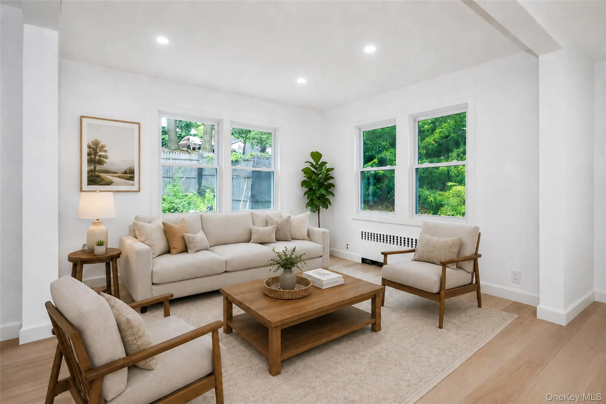 Virtually staged family room next to the front entrance. Virtually staged family room next to the front entrance.