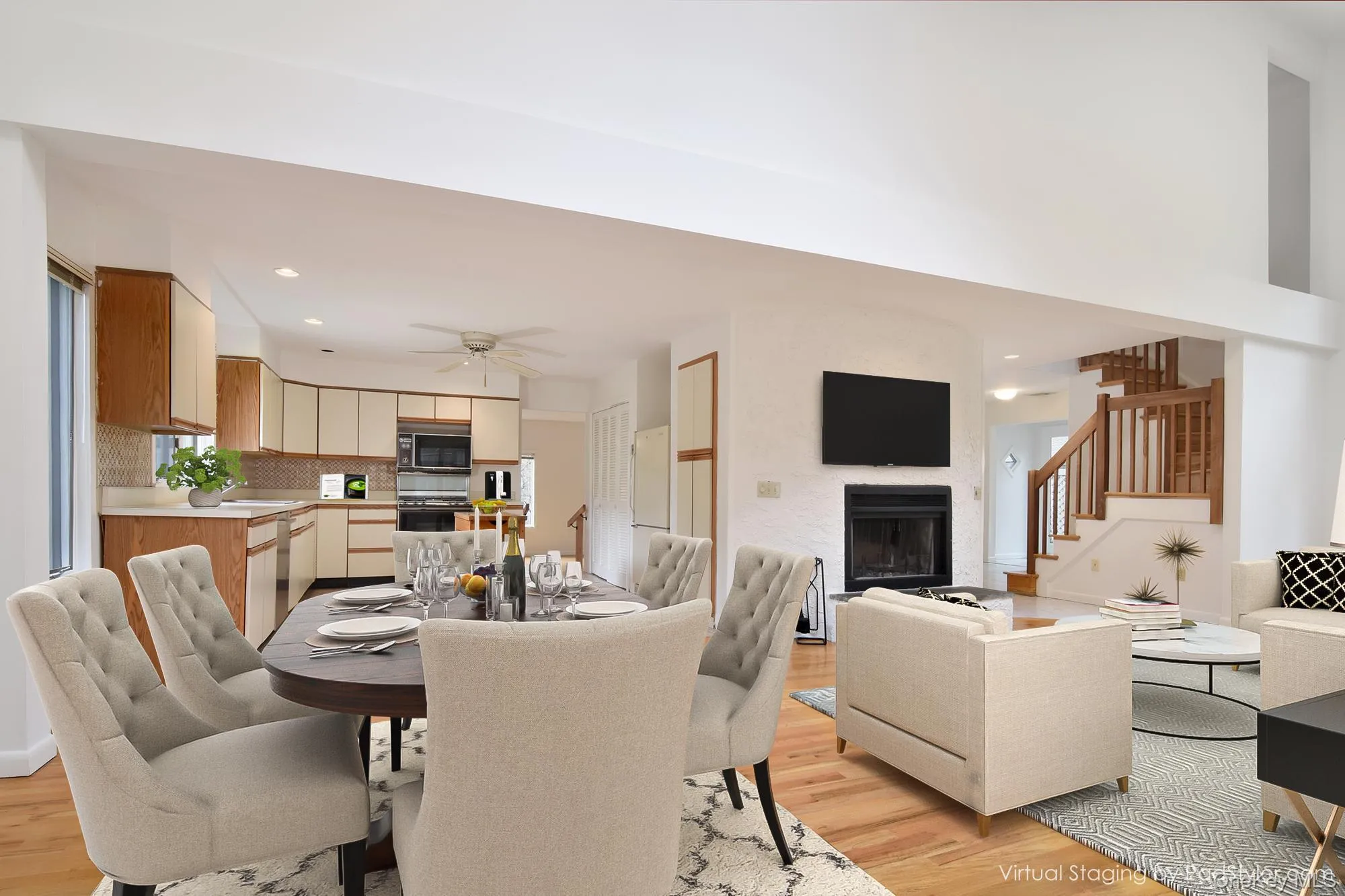 Virtually stagedDining area with vaulted ceiling, light wood floors, a fireplace and recessed lighting Virtually stagedDining area with vaulted ceiling, light wood floors, a fireplace and recessed lighting