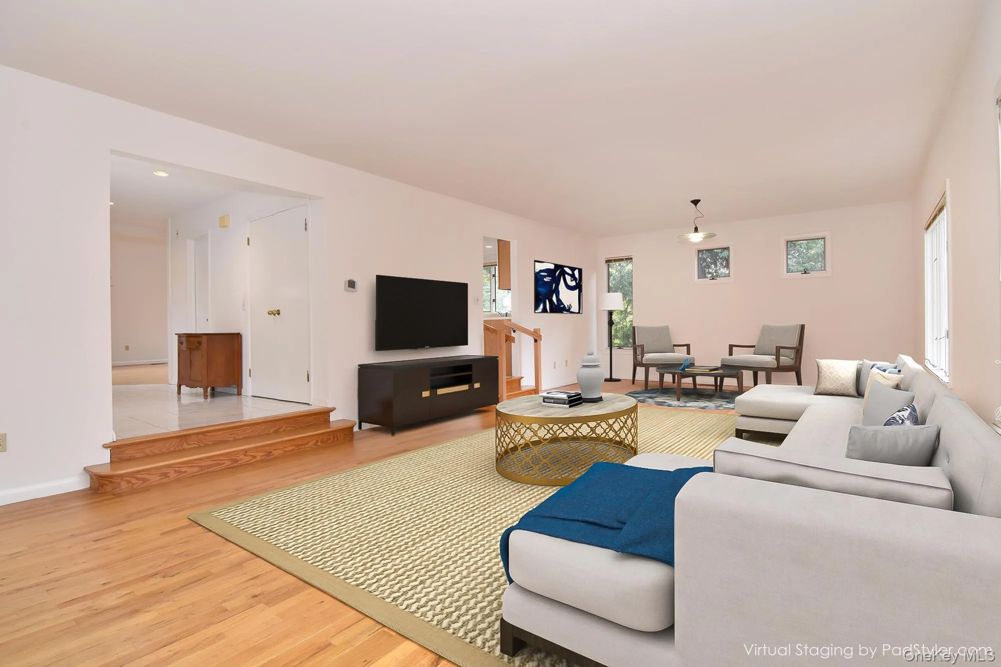 Virtually staged 30' Great Room with wall space for large TV and light wood finished floors Virtually staged 30' Great Room with wall space for large TV and light wood finished floors