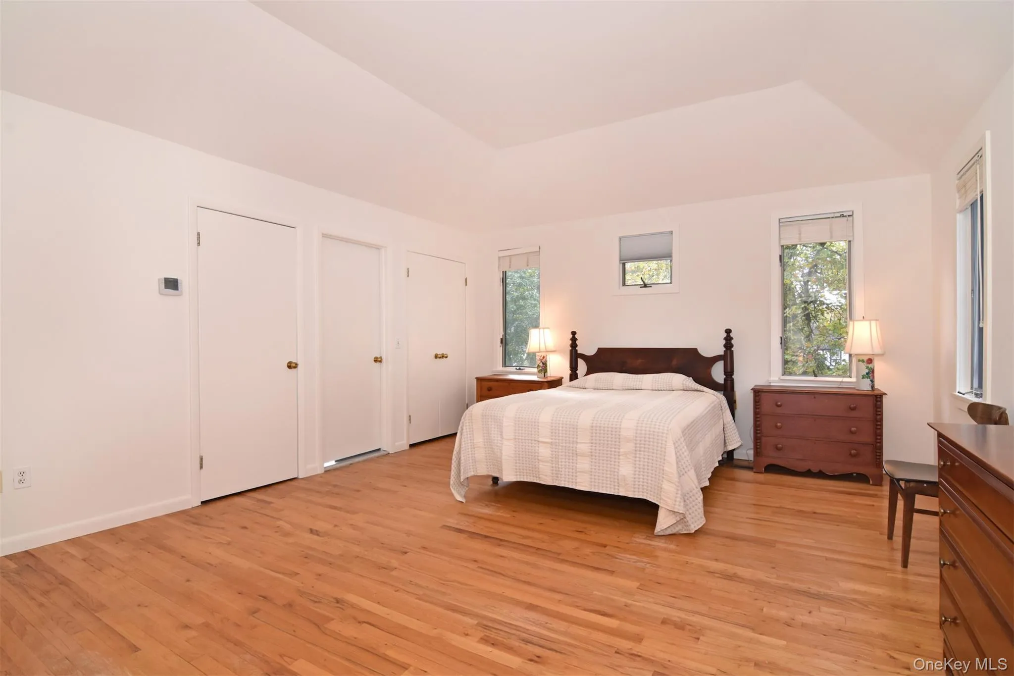 Large Primary Bedroom with 4 closets and full bath Large Primary Bedroom with 4 closets and full bath