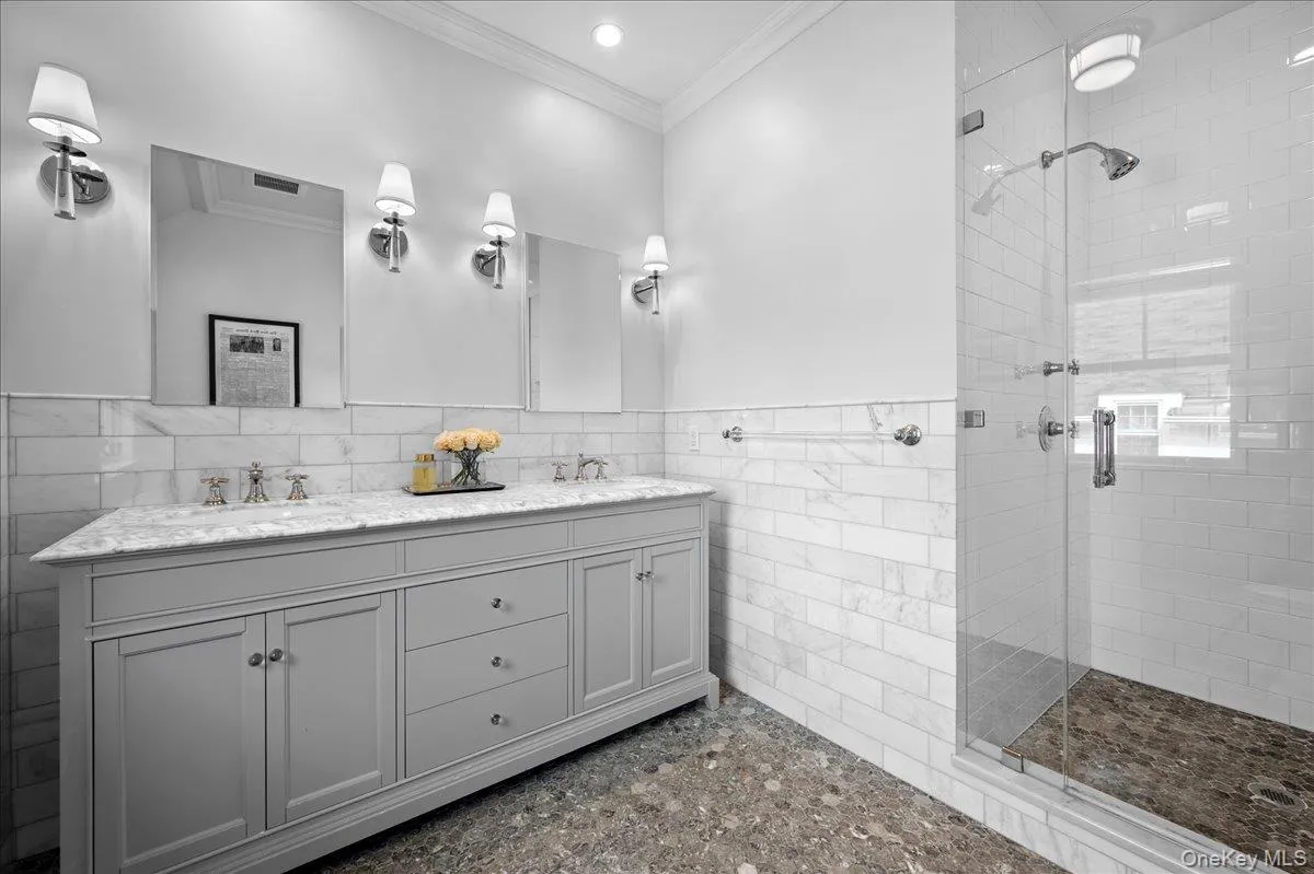 Ensuite primary bathroom with double sink vanity and spa walk in shower. Ensuite primary bathroom with double sink vanity and spa walk in shower.