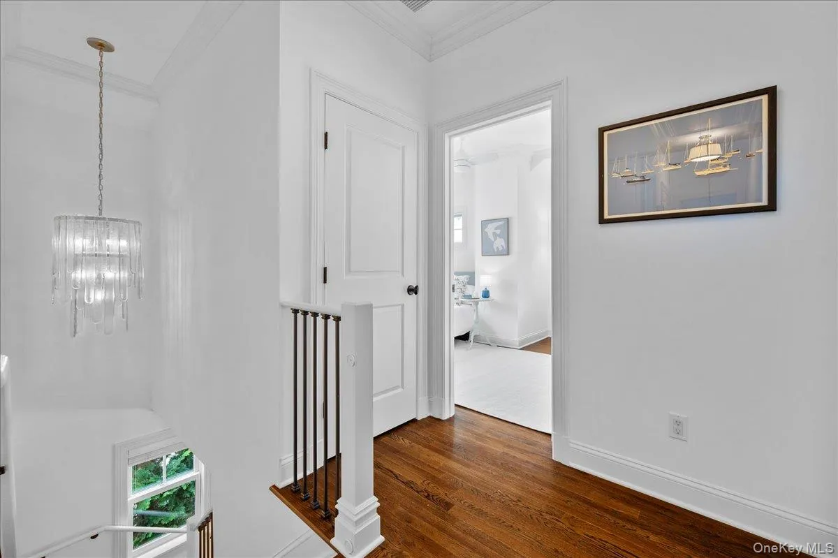 Double story staircase leading to the second floor, which features four bedrooms and two full bathrooms, as well as laundry. Double story staircase leading to the second floor, which features four bedrooms and two full bathrooms, as well as laundry.
