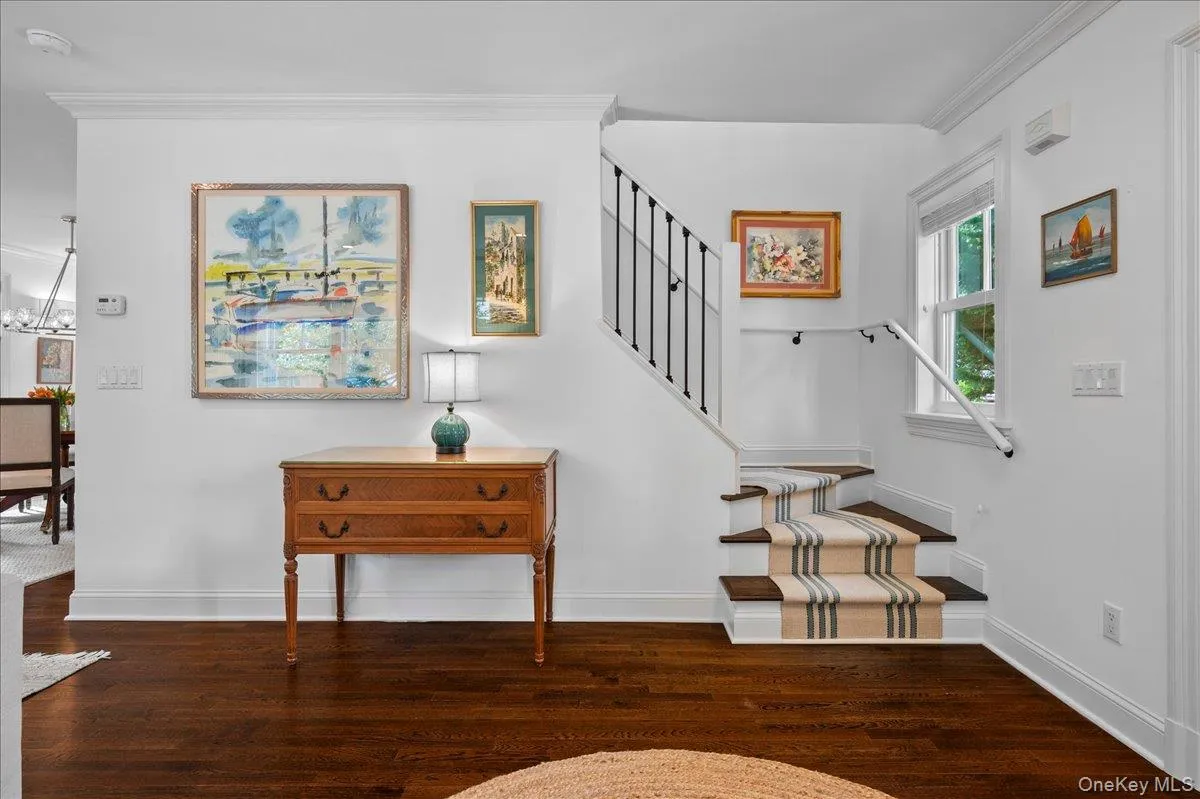 The spacious foyer features gleaming hardwood floors and opens directly to the living room and open concept layout of the first level. The spacious foyer features gleaming hardwood floors and opens directly to the living room and open concept layout of the first level.