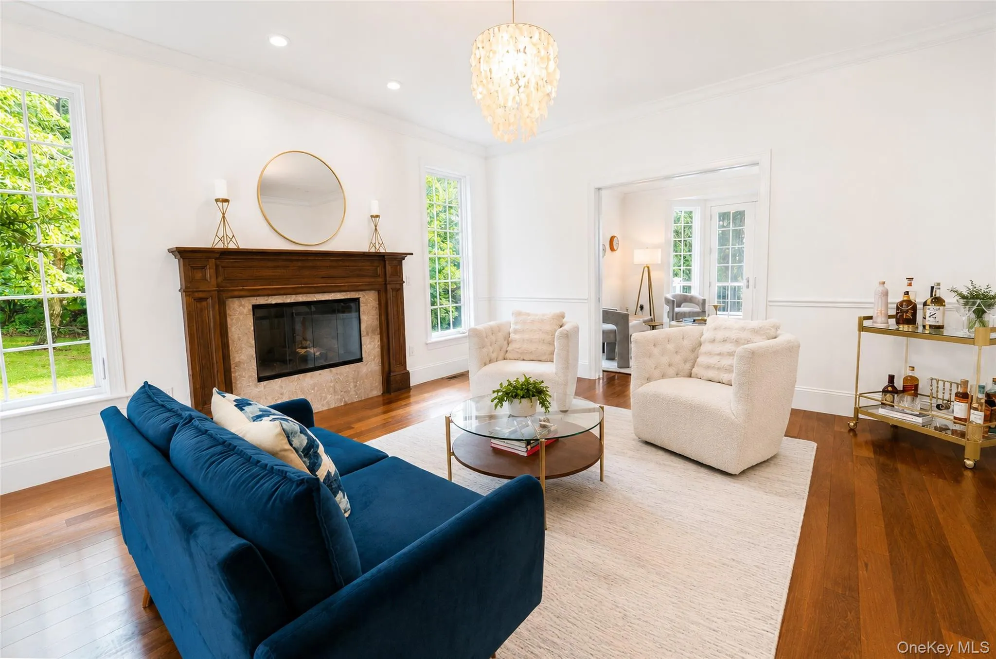 Another beautiful view of the den showcases its seamless connection to the family room, while elegant pocket doors provide privacy when desired. Another beautiful view of the den showcases its seamless connection to the family room, while elegant pocket doors provide privacy when desired.