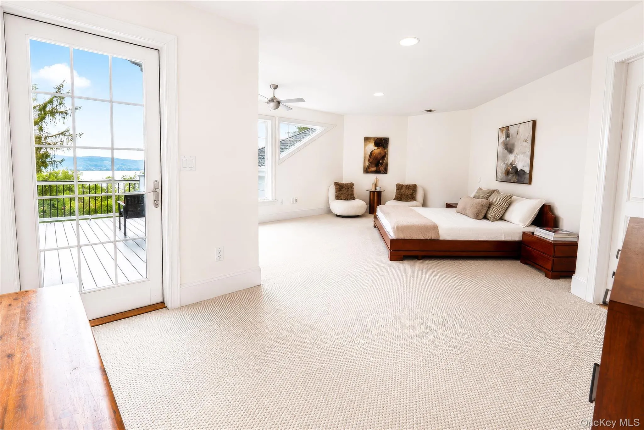 Imagine waking up in this spacious primary suite, where a wall of windows frames breathtaking views and fills the room with natural light. Imagine waking up in this spacious primary suite, where a wall of windows frames breathtaking views and fills the room with natural light.