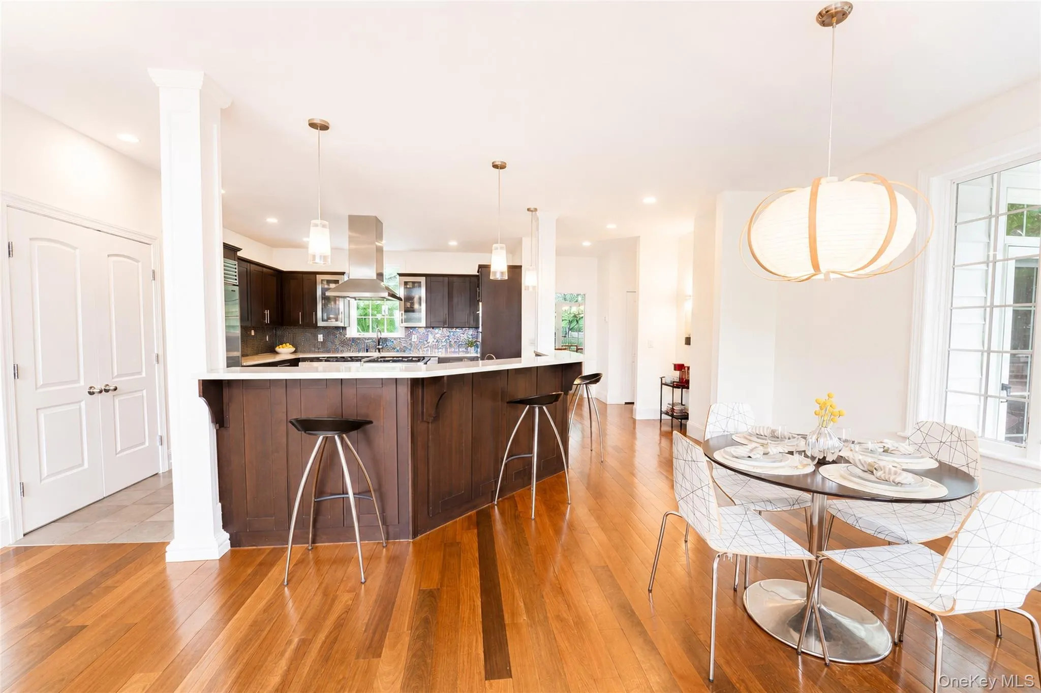 Another captivating view of this exceptional kitchen, thoughtfully positioned for effortless flow between the formal dining room, eat-in kitchen, and living room. Another captivating view of this exceptional kitchen, thoughtfully positioned for effortless flow between the formal dining room, eat-in kitchen, and living room.