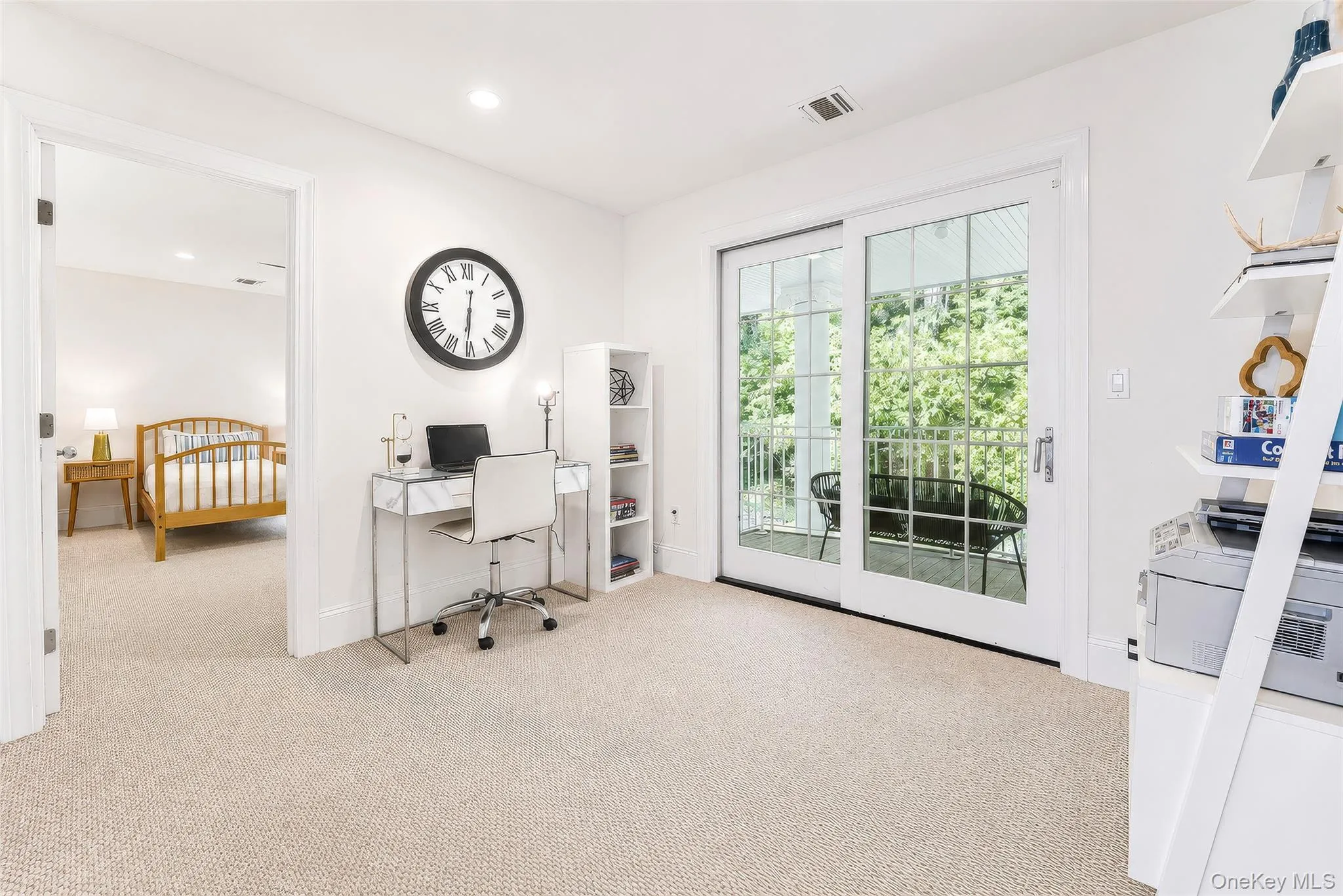 This loft is the perfect office space or sitting room with sliders to Juliet balcony. This loft is the perfect office space or sitting room with sliders to Juliet balcony.