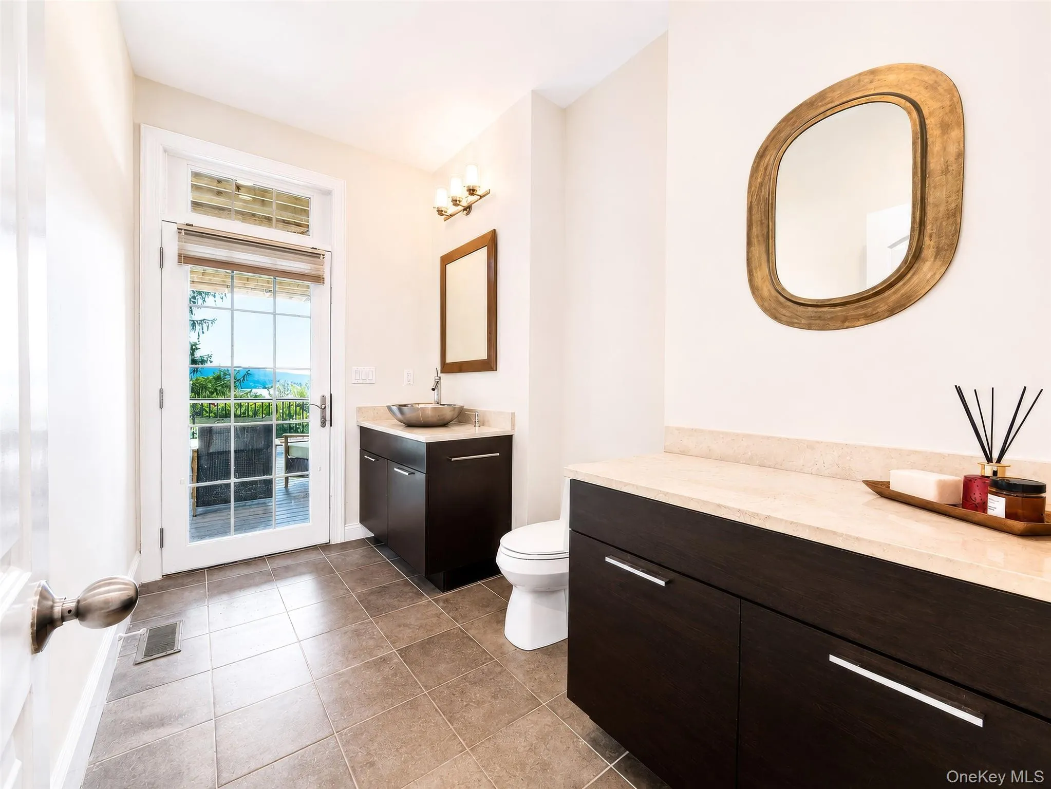 The main-level powder room offers convenience and easy access to the outdoor deck, enhancing comfort for everyday living and entertaining. The main-level powder room offers convenience and easy access to the outdoor deck, enhancing comfort for everyday living and entertaining.